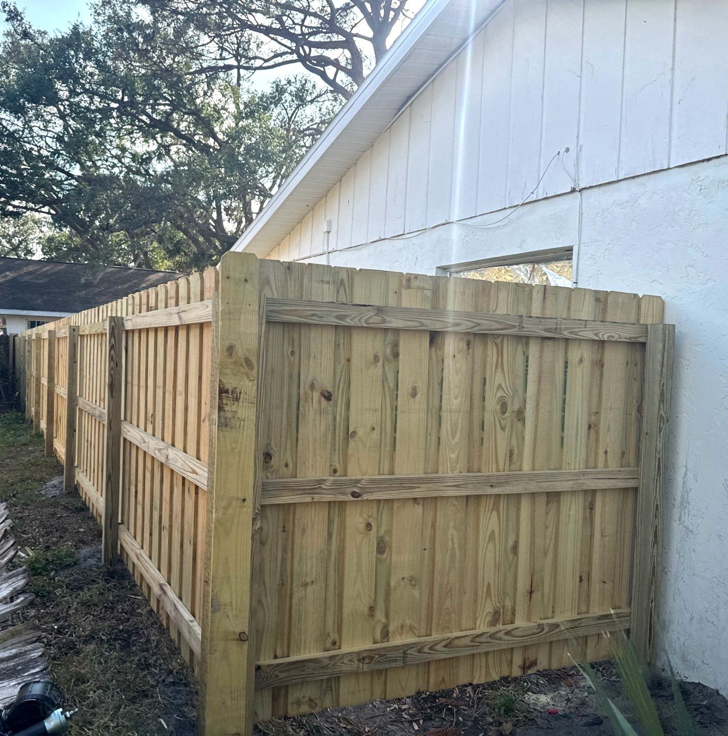 Wood Fence Installation using 6Ft Pressure Treated Wood Board On Board Privacy Fence by Asap fence and gates, LLC