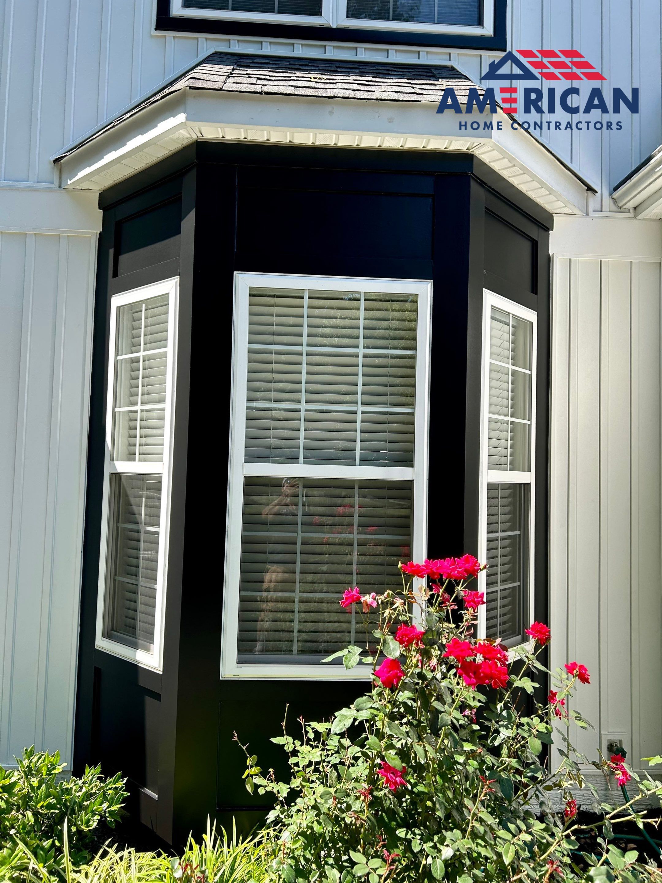 Vinyl Siding Replacement + Black Trim by American Home Contractors