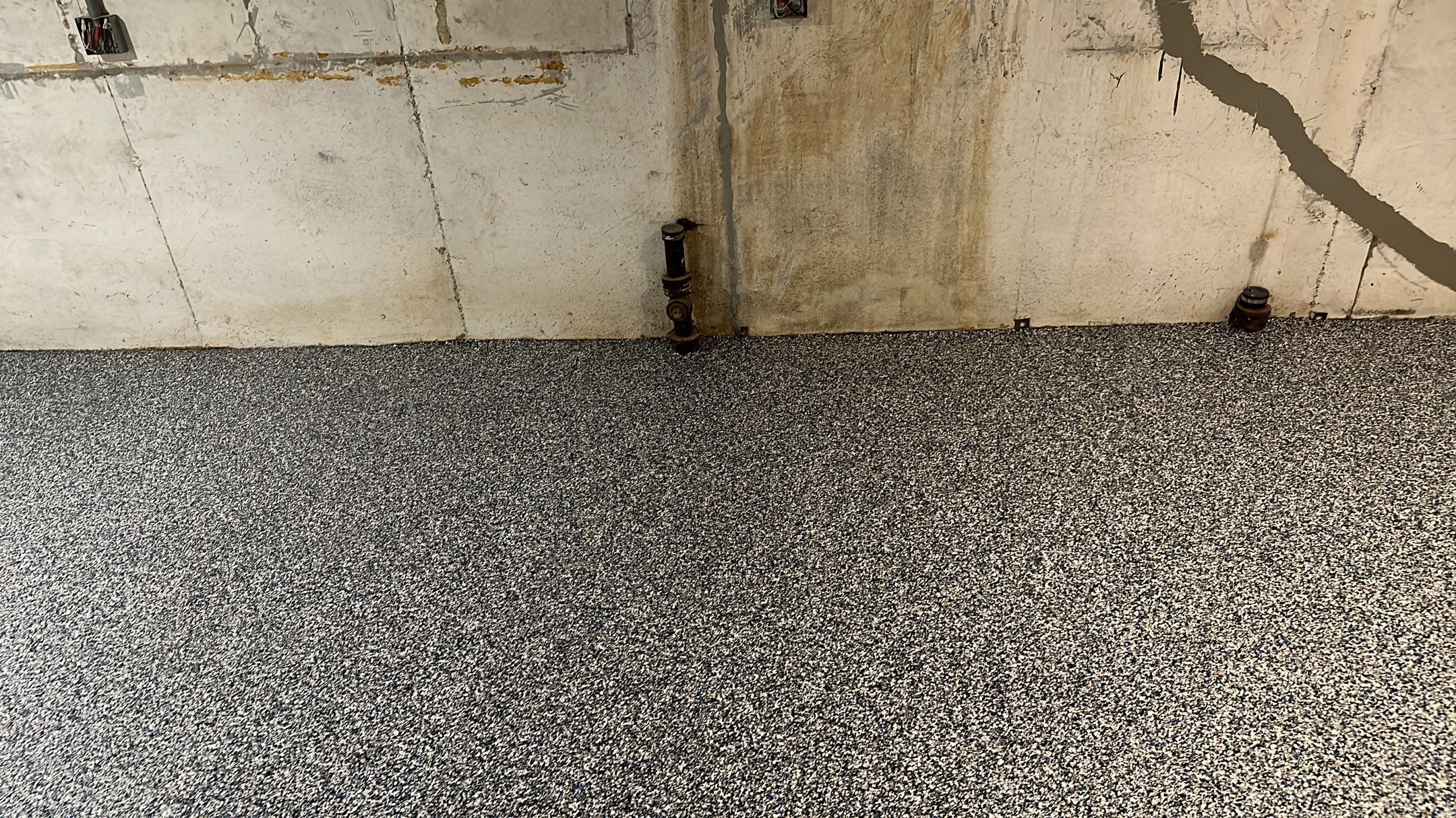 A beautiful Banner Garage Coating in a basement  by Banner Garage