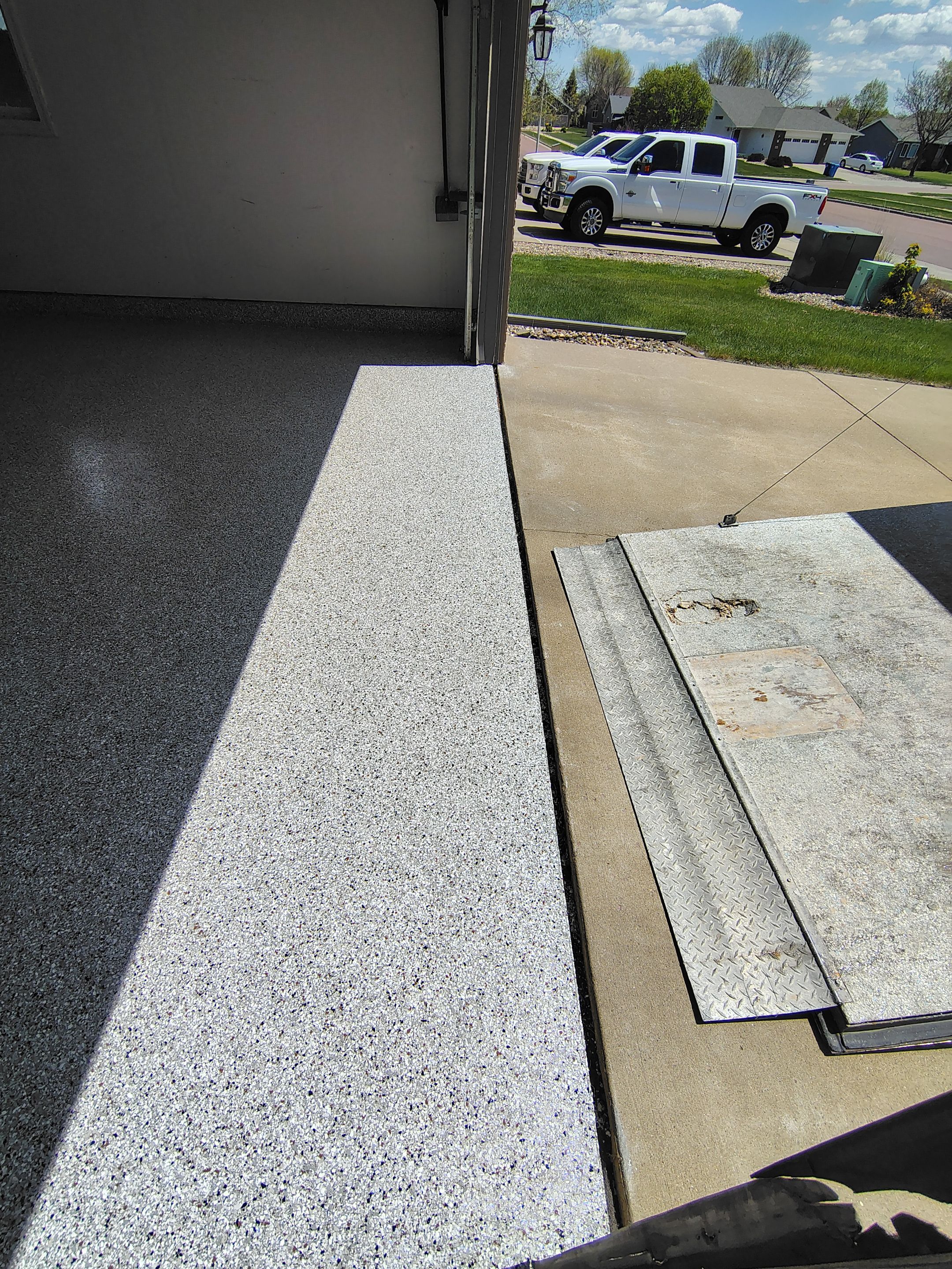 Decorative Chip Epoxy Garage Floor Coating in Sioux Falls by Select Painting, Coatings & Garage Cabinets