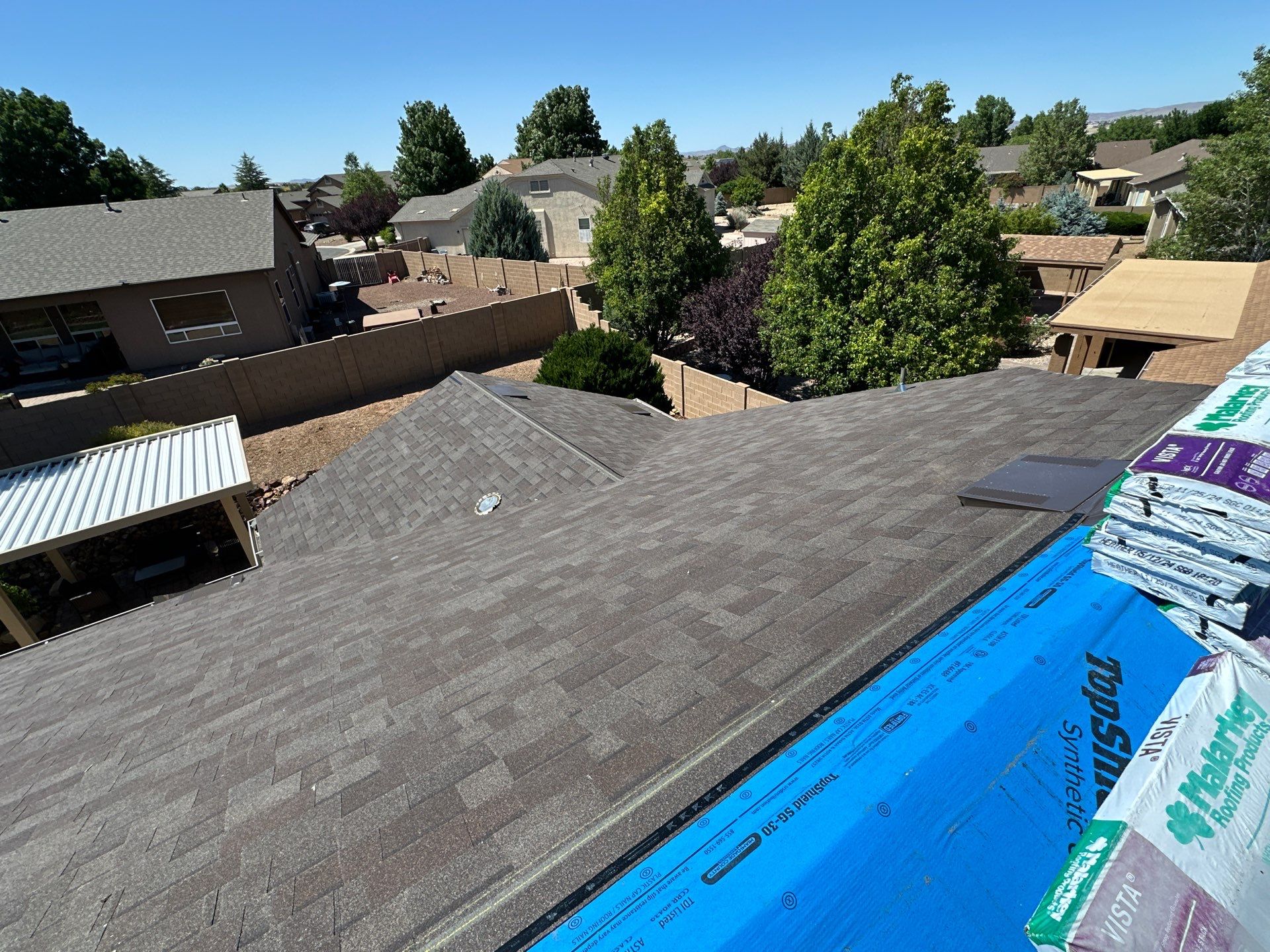 Residential Roofing Installation with Architectural Shingles and Turret Detail by Badger Roofing