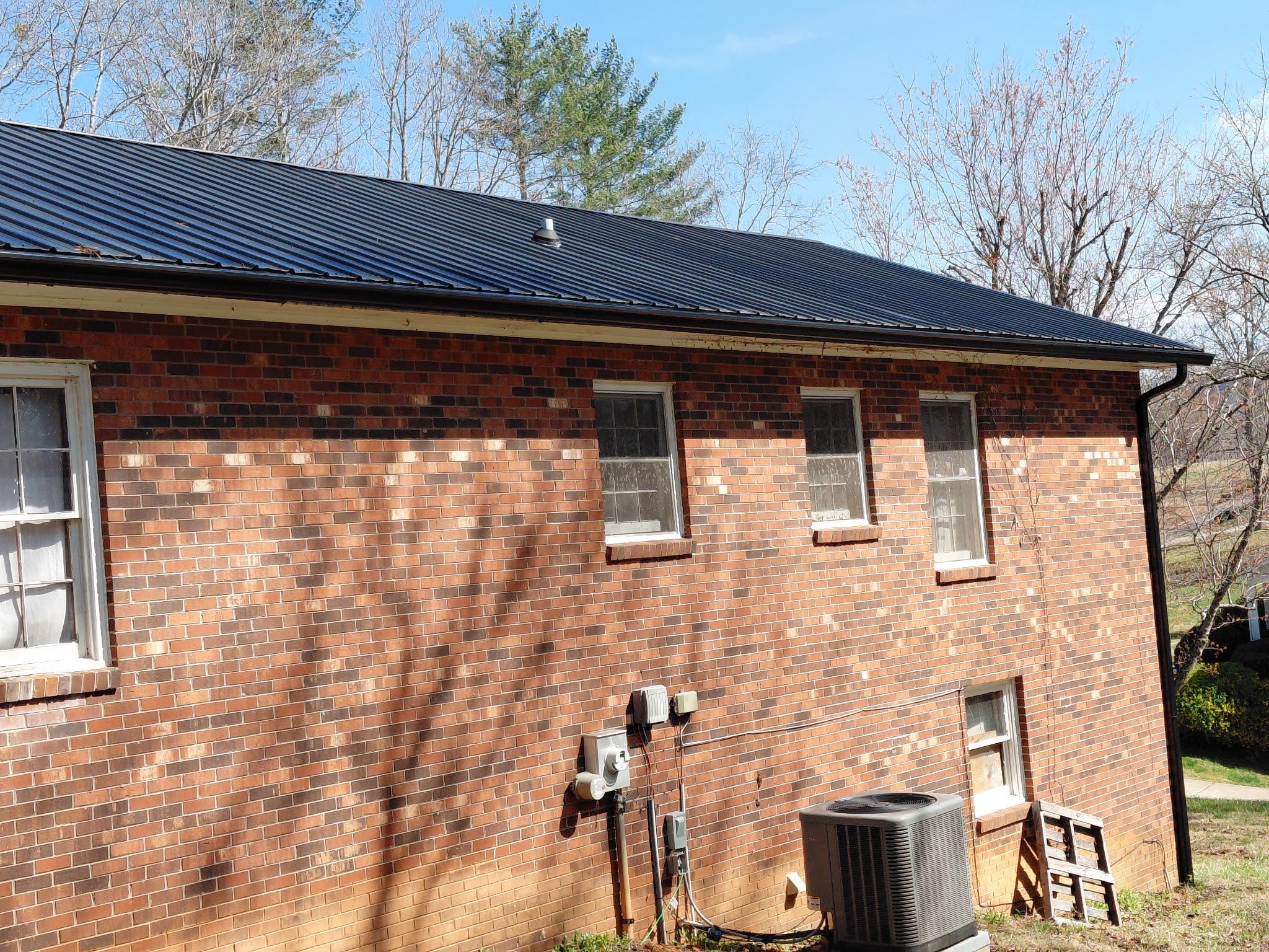 6" Black Gutters and Guards by Peak 2 Peak Services LLC