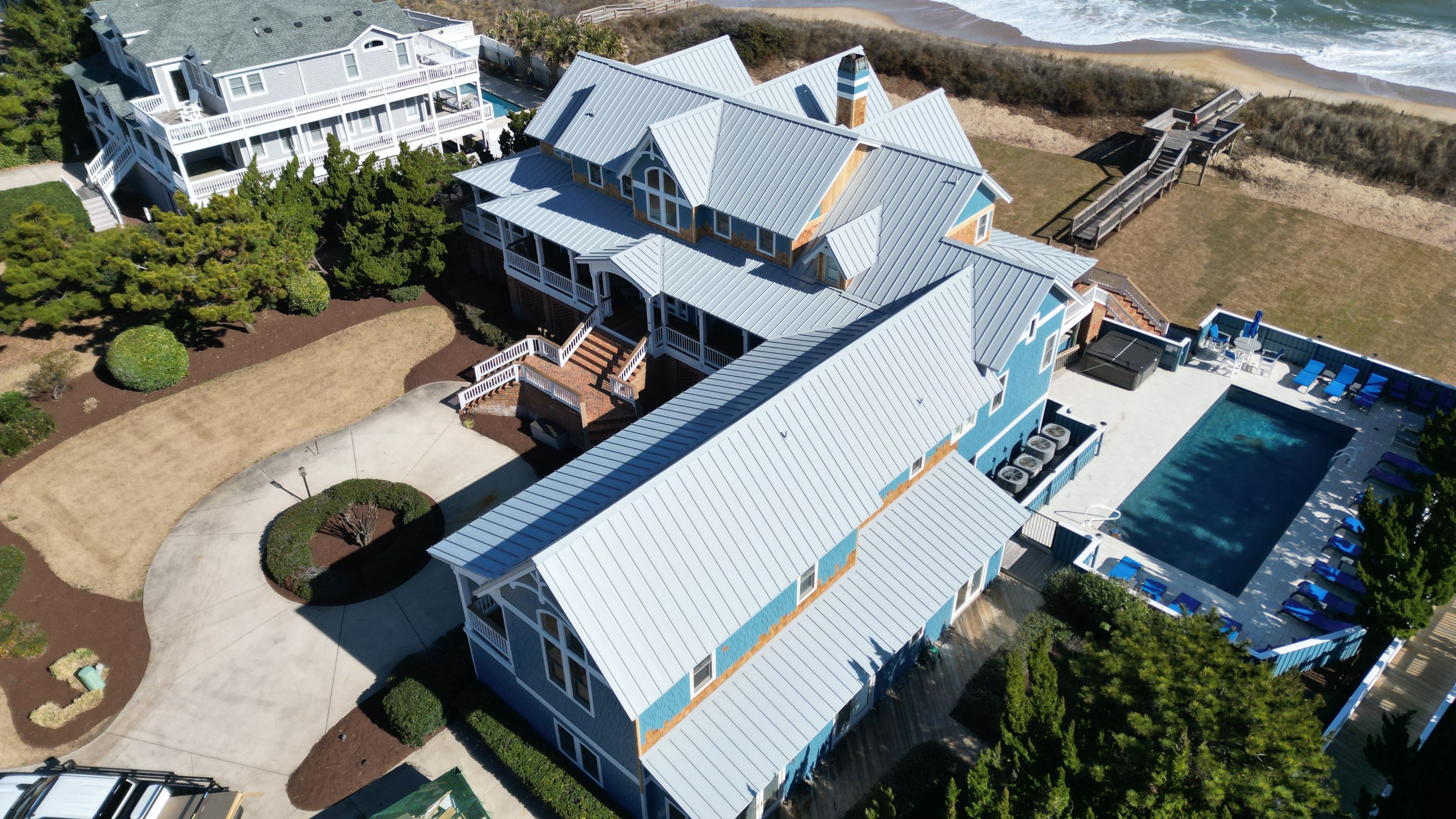 Large Metal Roof Transformation by Gallop Roofing & Remodeling, Inc.