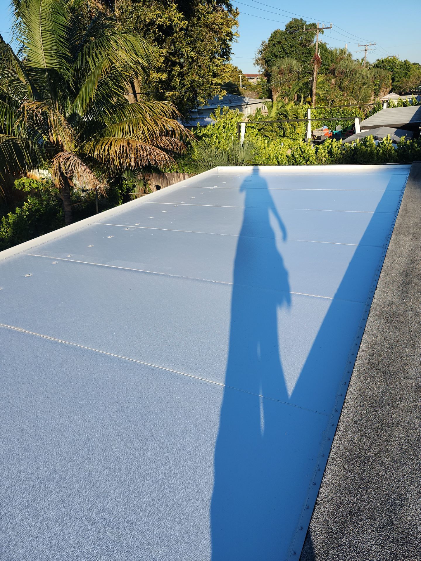 Insulated Screen Enclosure and Wood Tile Deck Installation in Plantation by Aastro Roofing