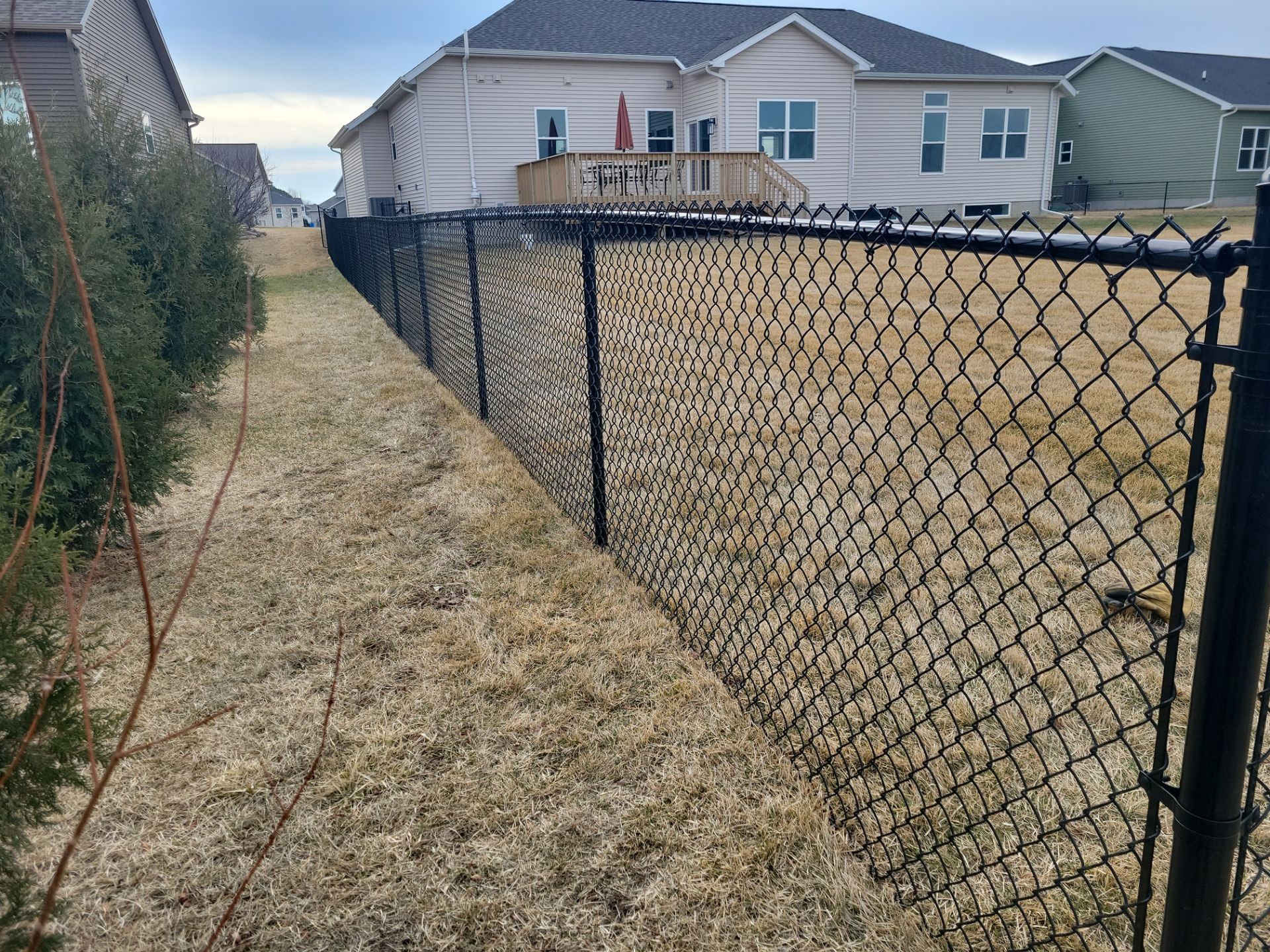 Black Chain Link Fence and Gate Installation in Cedar Falls by Perfect Picket Fence and Stain