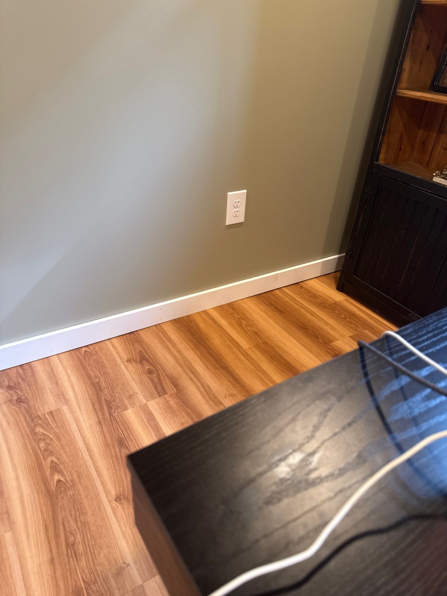 Lincoln Basement Office Renovation with Sage Green Walls and Laminate Flooring by CompanyCam Sales Demo