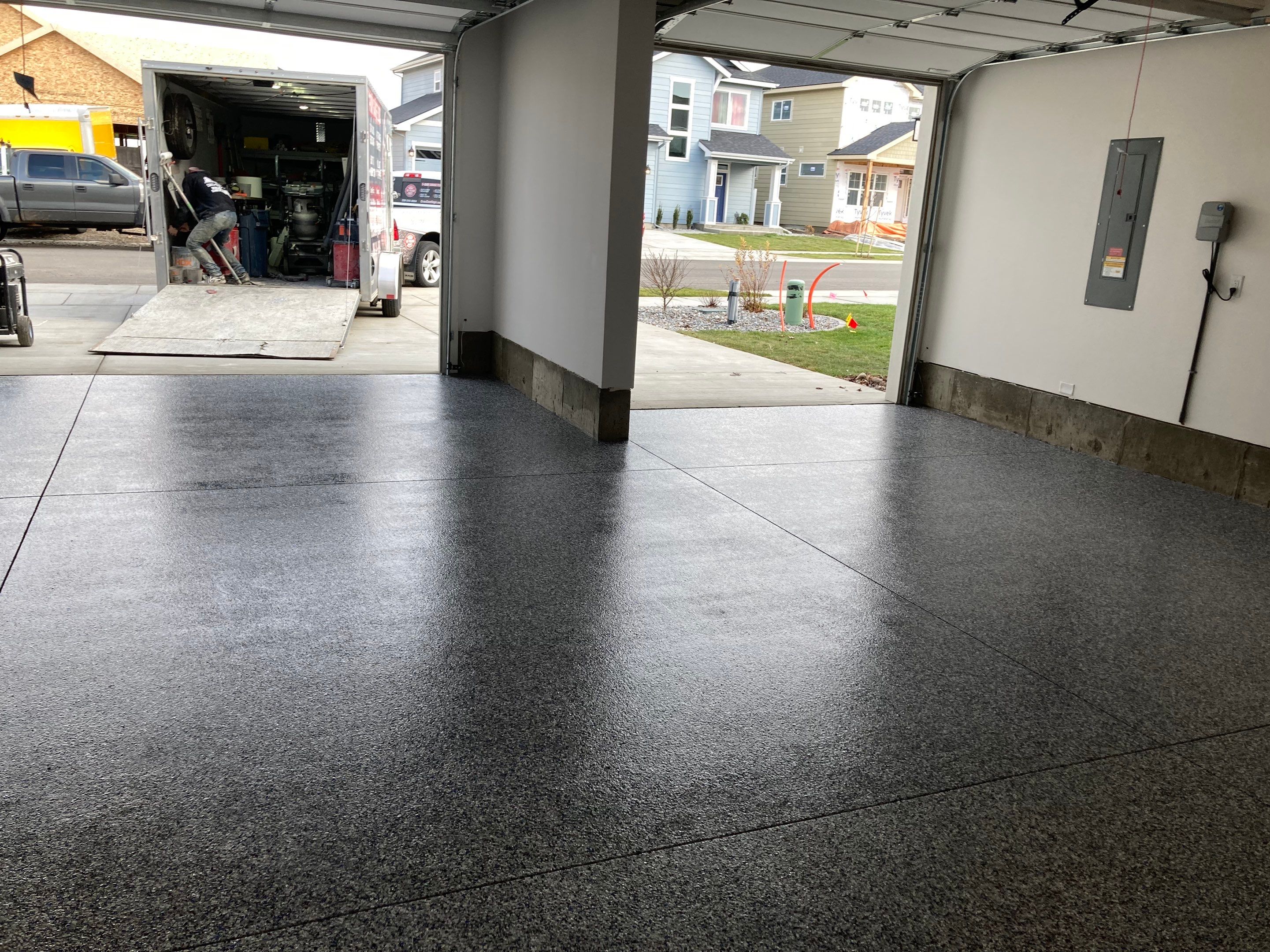 Garage Transformation using Domino with Blue by Croc Coatings, LLC