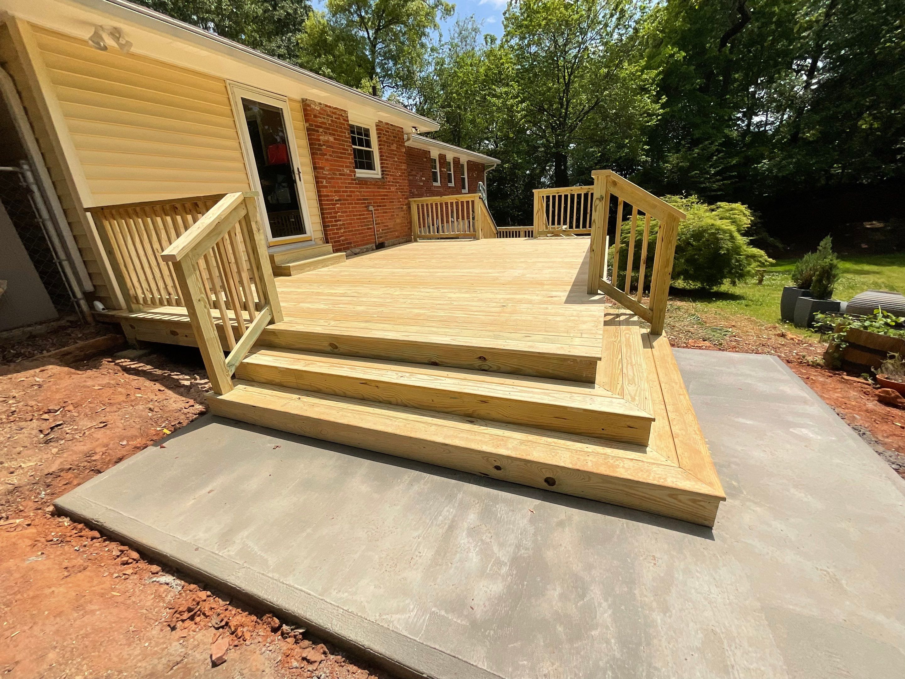 Custom Pressure-Treated Wood Deck and Railing Installation in Decatur by Swift Home Renovations