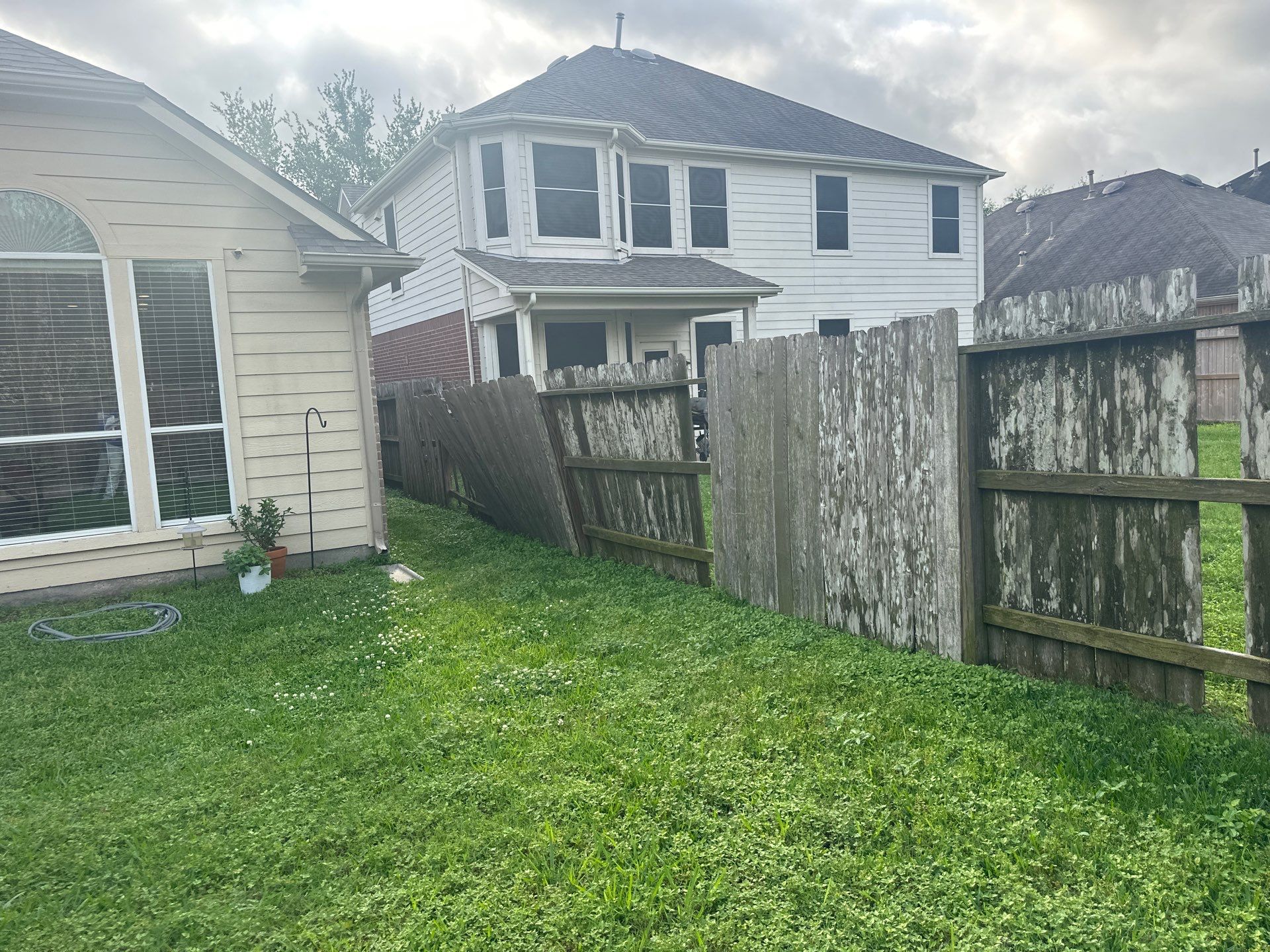Wood fence with alternating panels by Tim's Fences
