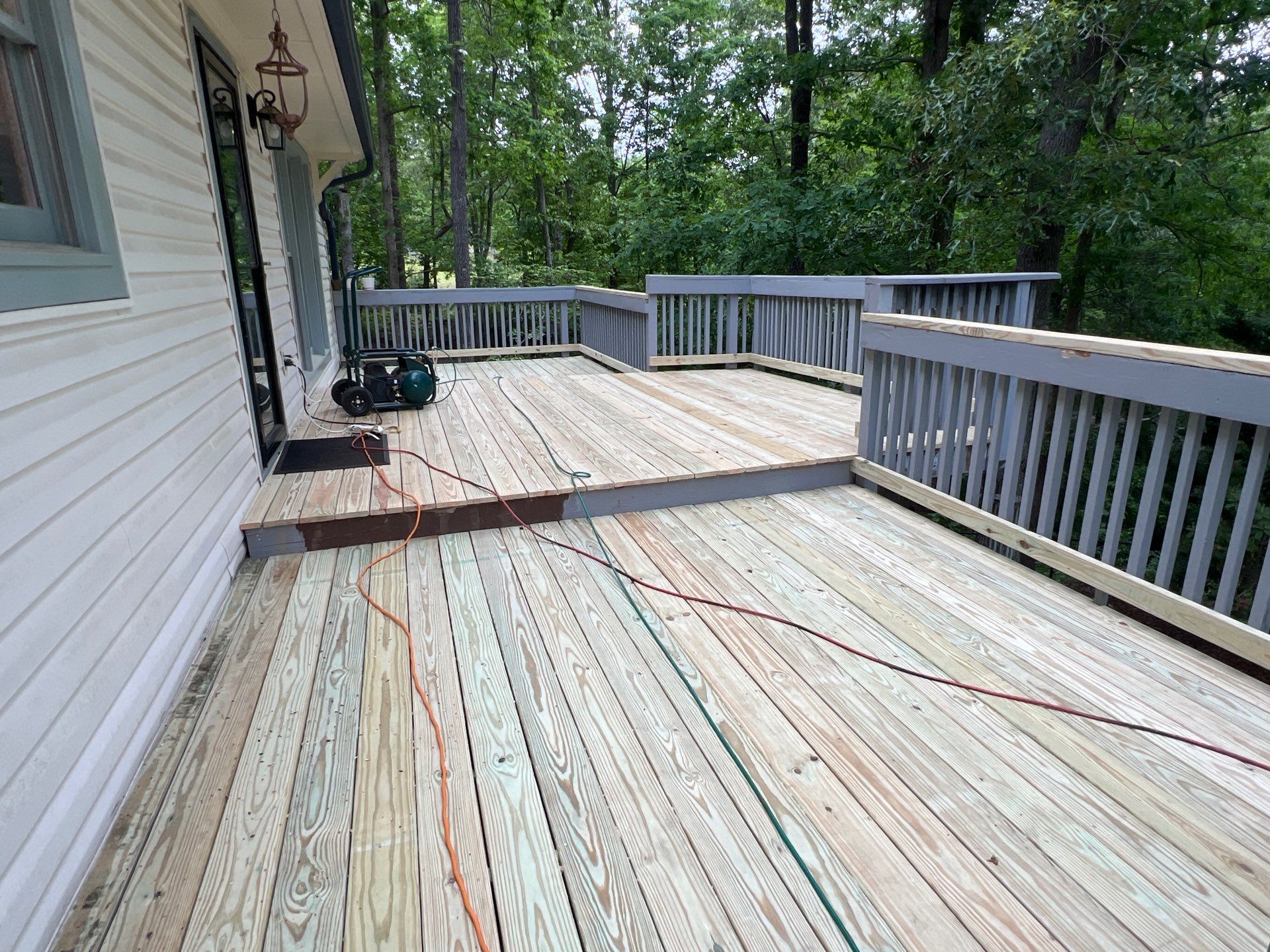 Pressure-Treated Wood Deck Resurfacing and Staircase Reconstruction in Canton by Swift Home Renovations