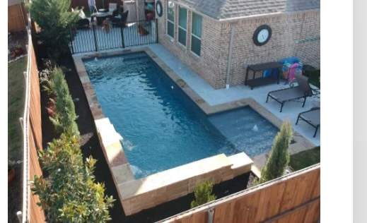 Freeform Pool with Tanning Ledge and Stone Decking by Pinnacle Pools and Spas - DFW