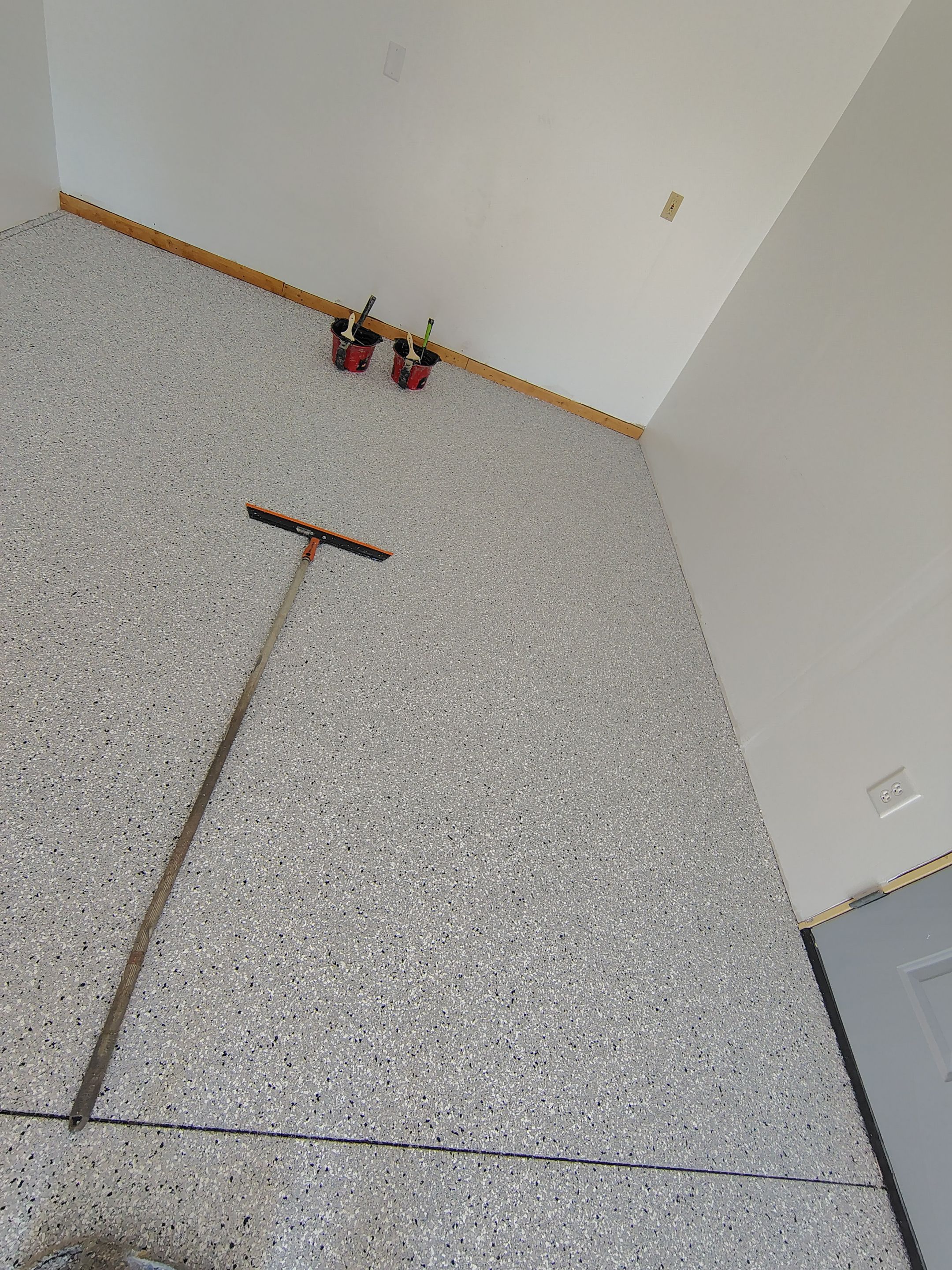 Decorative Chip Concrete Coating Installation in Luverne by Select Painting, Coatings & Garage Cabinets