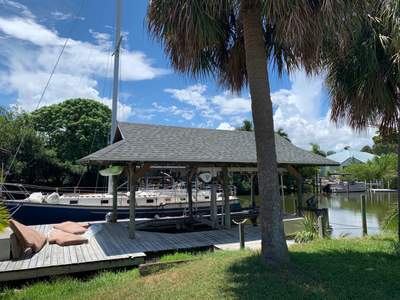 Residential Boat Dock Shingle Roof Installation in Satellite Beach