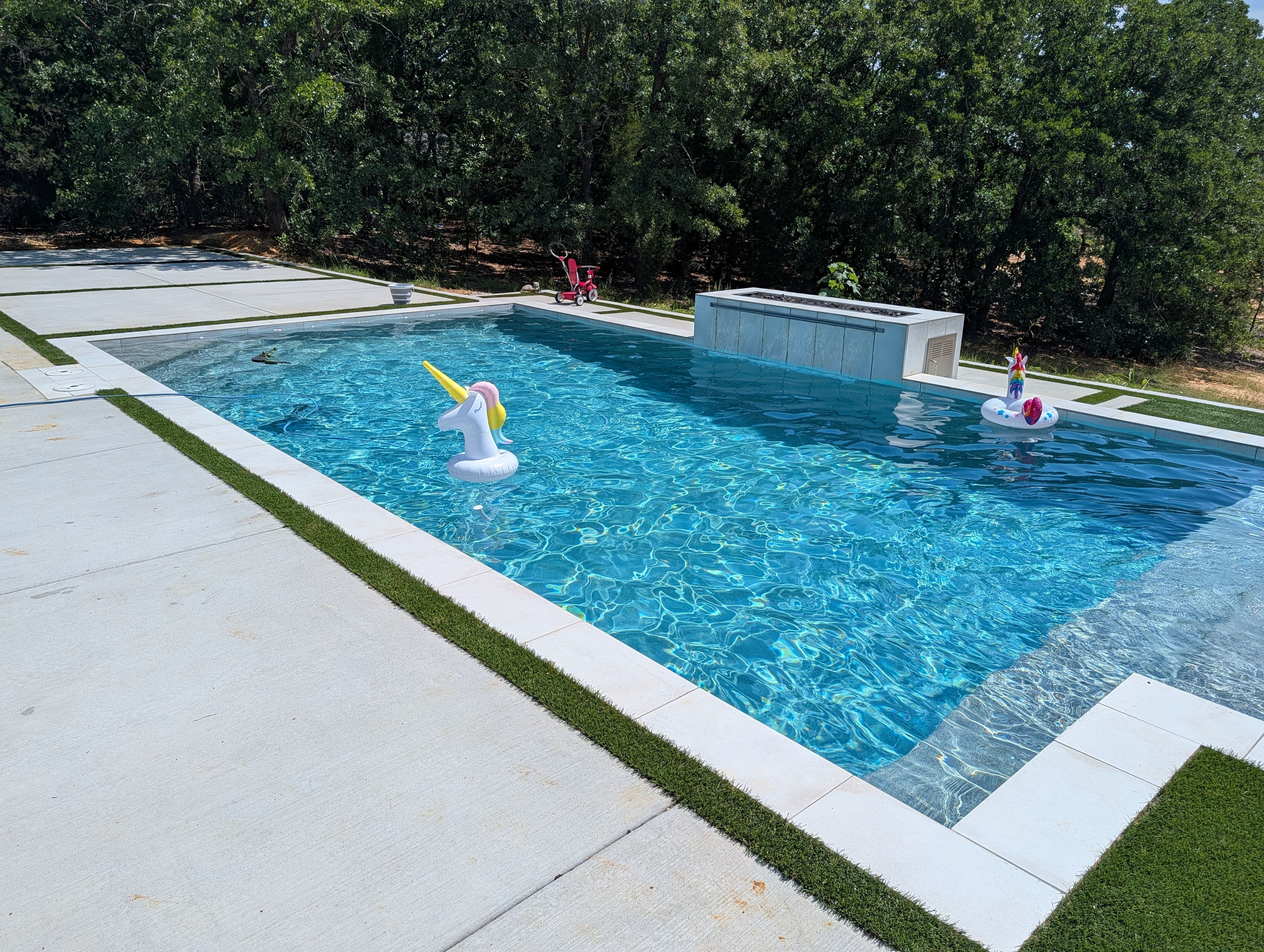 Modern Geometric Pool with Raised Spa and Turf Accents by Pinnacle Pools and Spas - DFW