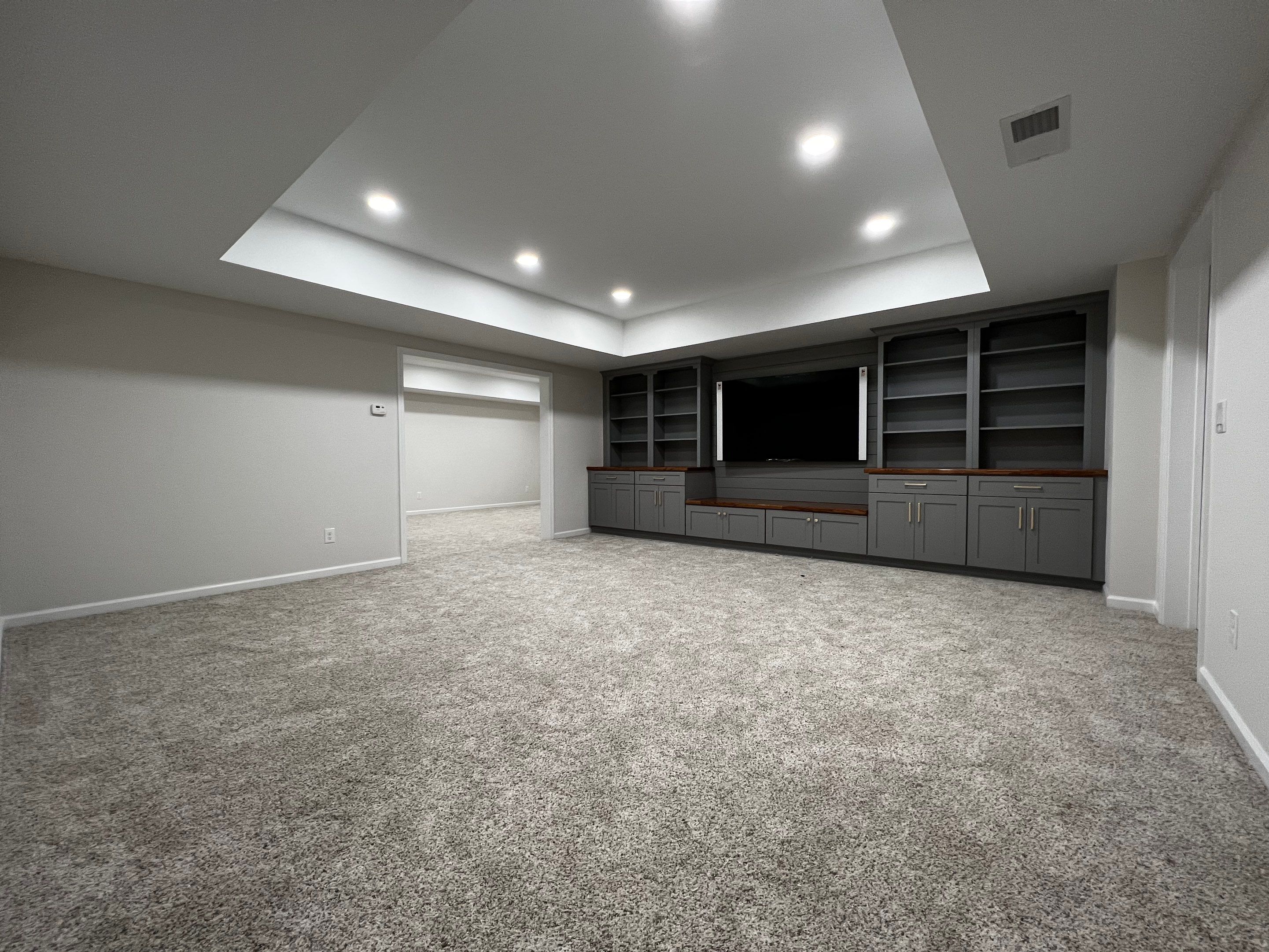 Finished Basement with Custom Built-ins and Full Bathroom in Acworth by Swift Home Renovations