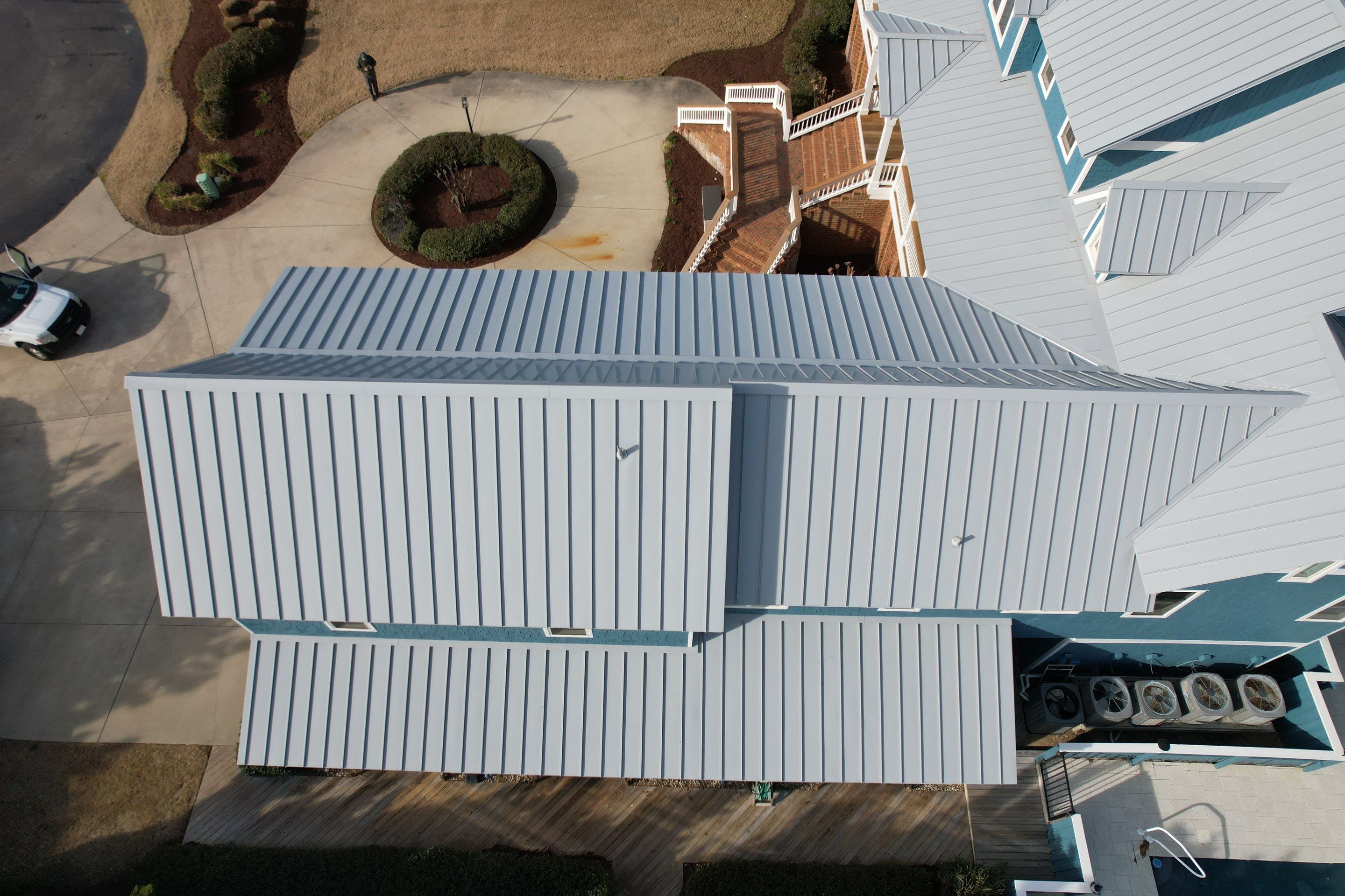 Large Metal Roof Transformation by Gallop Roofing & Remodeling, Inc.