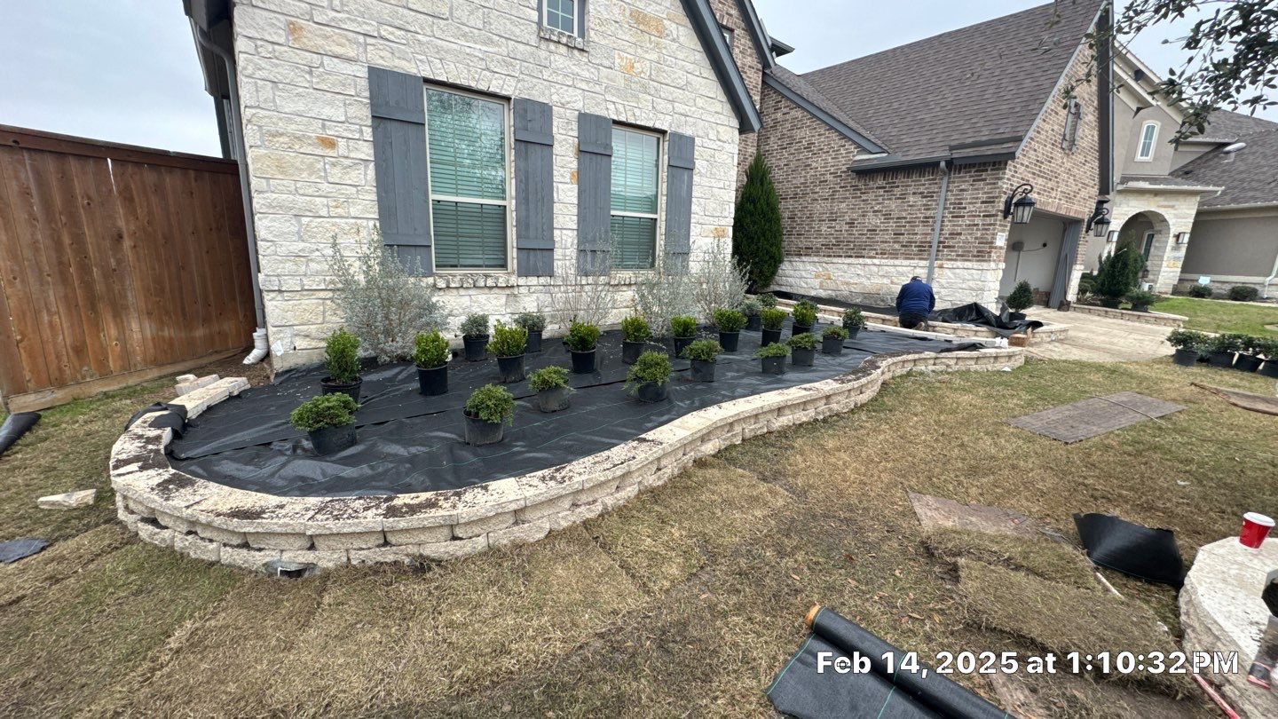🌿✨ Darlene & Andrew’s Amazing Curb Appeal Transformation  Some projects are more than just landscaping—they’re a conversion of curb appeal from the ground up. For Darlene & Andrew, Alejandro and the Texas Urban Team designed and delivered a complete solution that reshaped their flower beds, solved drainage challenges, and gave new life to the sideyard.  💡 From planning to execution, every step was tailored to build both beauty and functionality:  🌸 Flower Beds, Reinvented  Demolition of old beds, plants, and mulch.  Fresh soil preparation, weed protection, and a brand-new retainer wall built with hand-cut stone and decorative caps.  Carefully selected plants and garden mix to ensure health and visual harmony.  💧 Drainage & Irrigation Upgrades  Outdated corrugated pipes replaced with PVC drainage lines to carry water safely away from the foundation.  New irrigation system combining drip lines and sprinklers—watering plants while keeping the house walls protected.  Sideyard drainage extended with catch basins and PVC piping to prevent water pooling and foundation stress.  🚶 Functional Sideyard with Walkway & Trash Area  Graded and leveled sideyard to manage runoff.  Installed a modern gravel and paver walkway for easy access.  Built a firm and tidy concrete-paver pad for trash containers—making the space both practical and polished.  🛠️ Stonework & Craftsmanship  Every stone in the retainer wall was cut, set, and secured by the team of handcrafters, ensuring a durable build that doubles as a design statement.  ✅ Outcome: Darlene & Andrew’s property now has better drainage, a clean and organized sideyard, and elegant new flower beds—all designed for long-term durability and lasting beauty.  📢 Before hiring anyone, review our portfolio. Our work speaks louder than words—each project is a blend of function, protection, and design crafted to last. by Texas Urban Elements