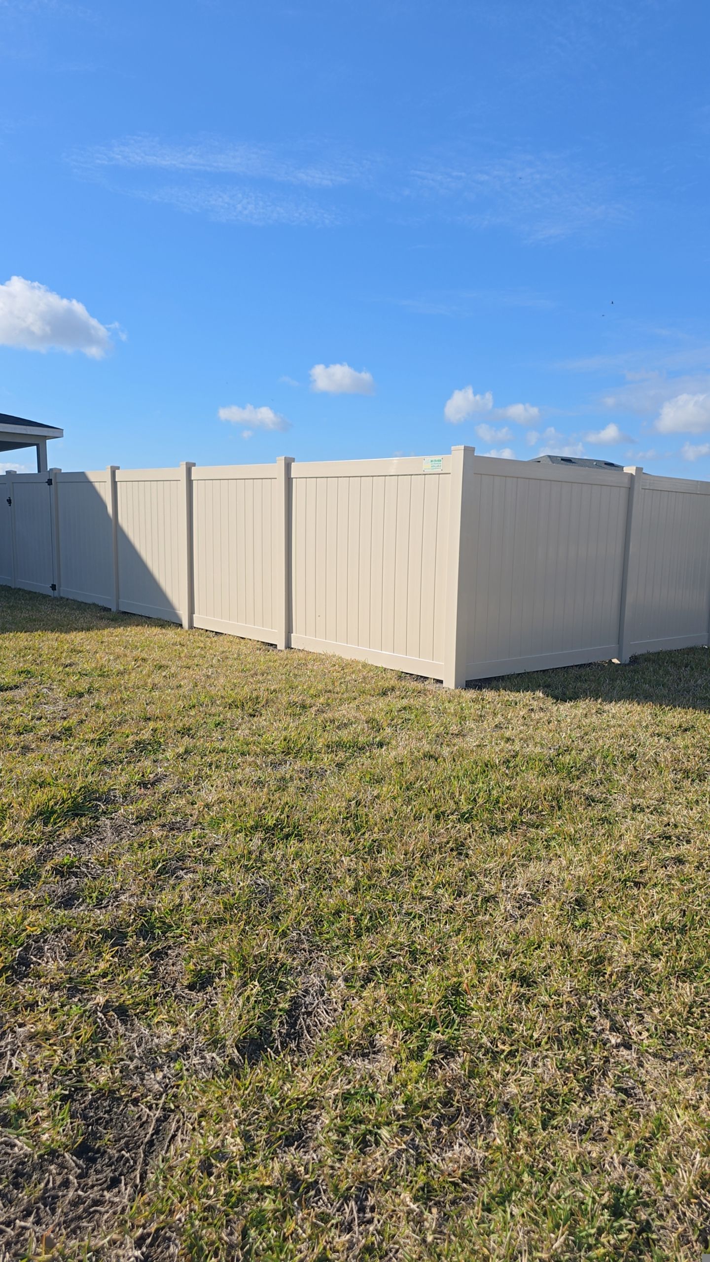 Tan Vinyl Fence in West Port by True Fence LLC