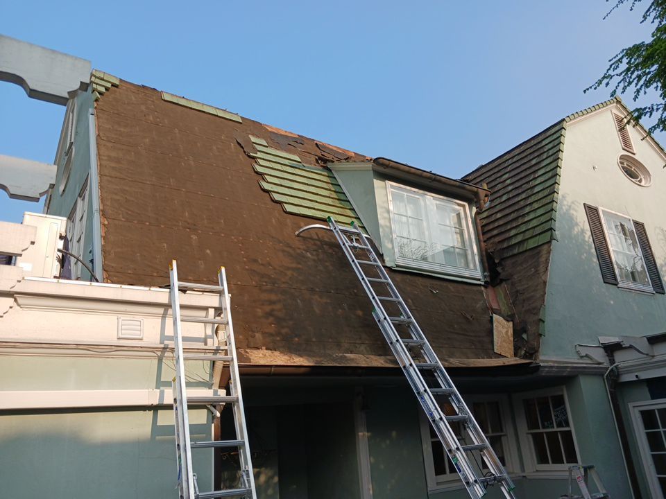 Slate removal/Cedar Shake replacement by Storm Contracting 
