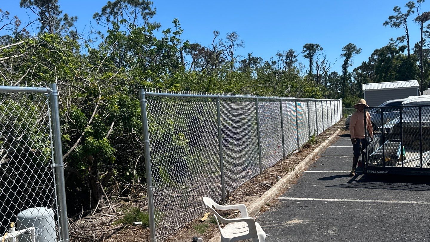 Commercial Chainlink and Vinyl Fence With Aluminum Framed Gates On Dumpster Enclosure by Asap fence and gates, LLC