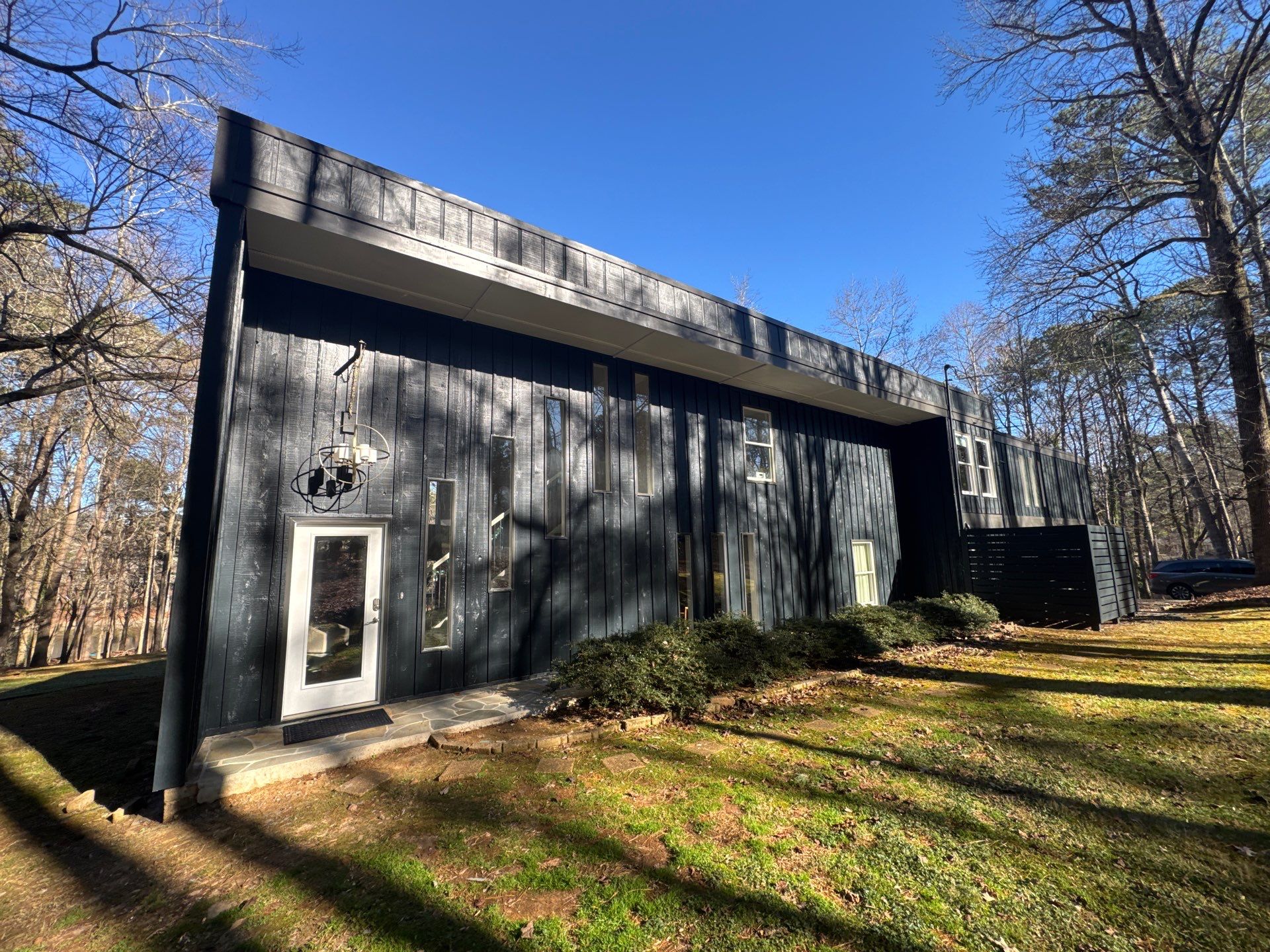 Full Exterior Transformation With Modern Black Finish by Swift Home Renovations