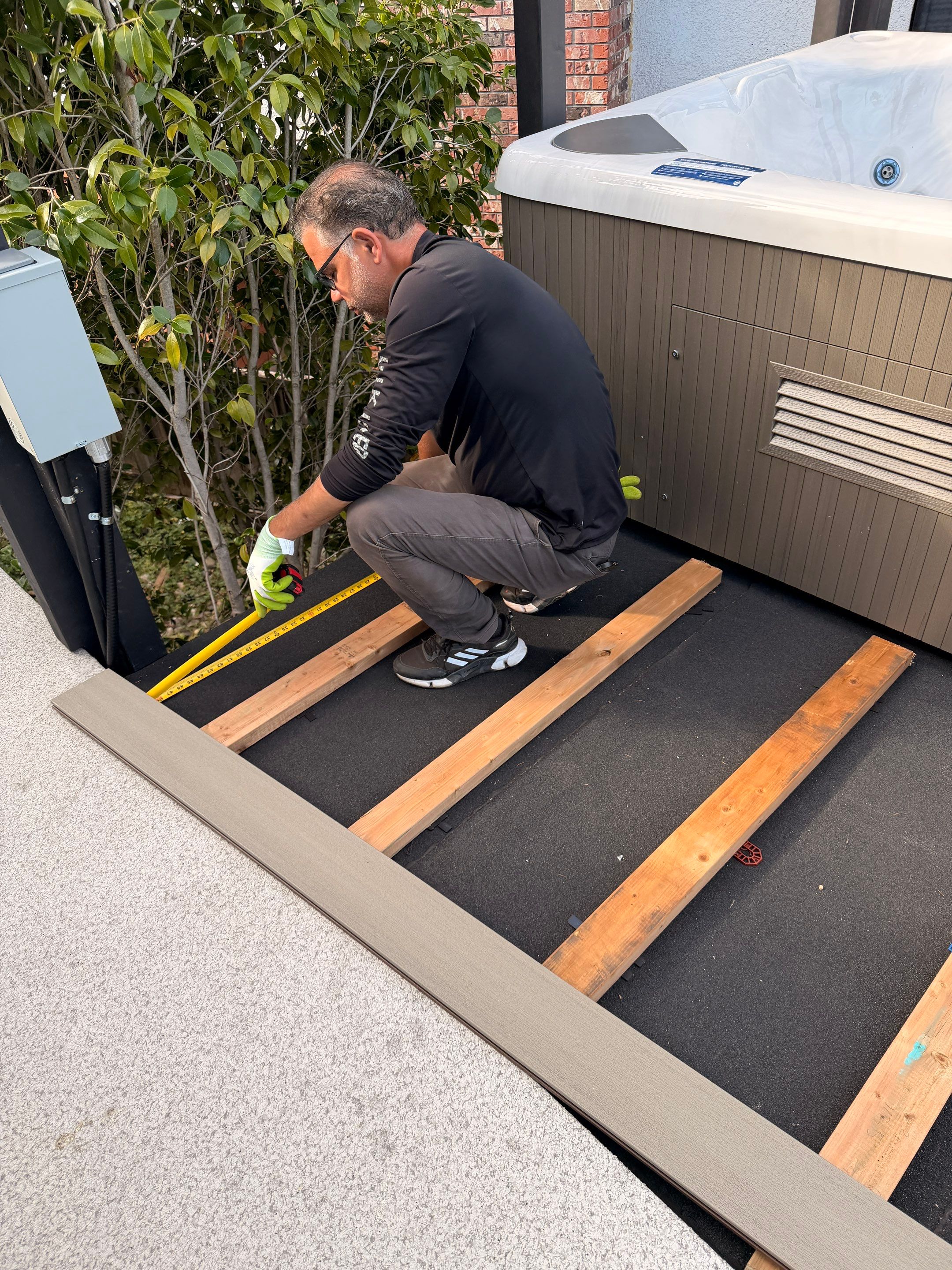 New Composite Deck with glass railing in North Vancouver by YVR Construction Group
