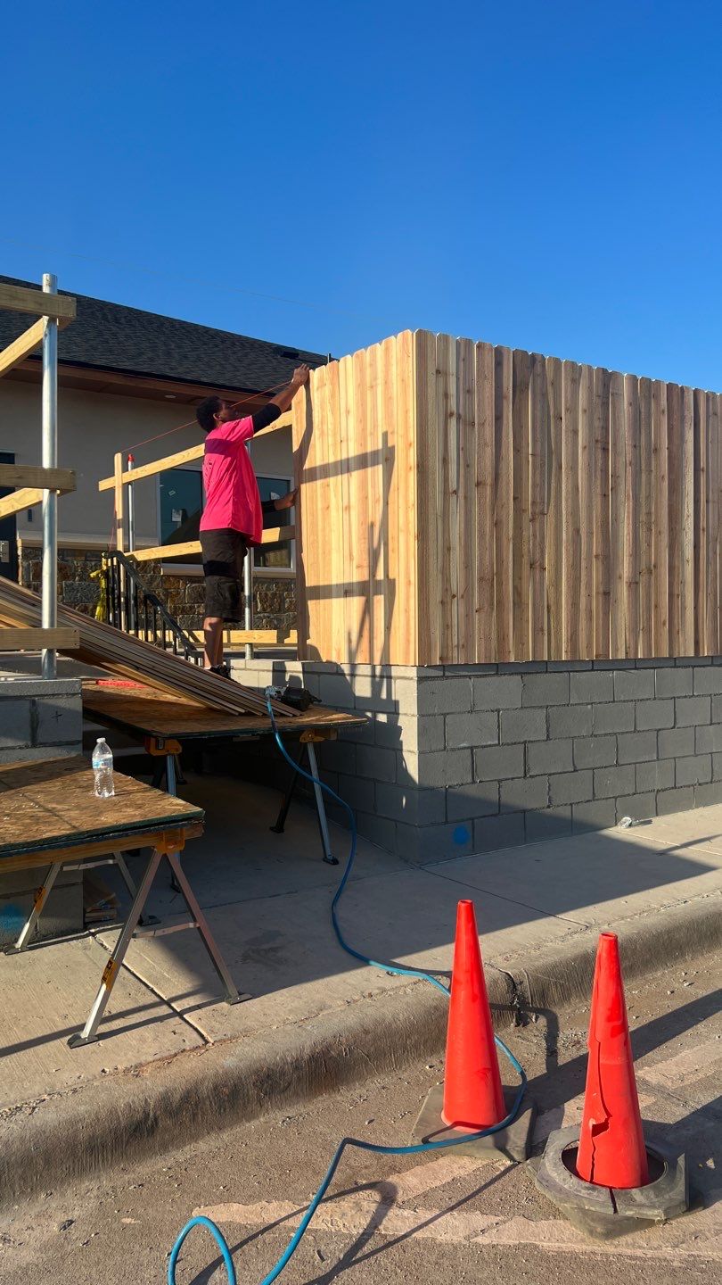 Cedar Fence using Cedar Pickets and Metal Poles by Clays Services Inc