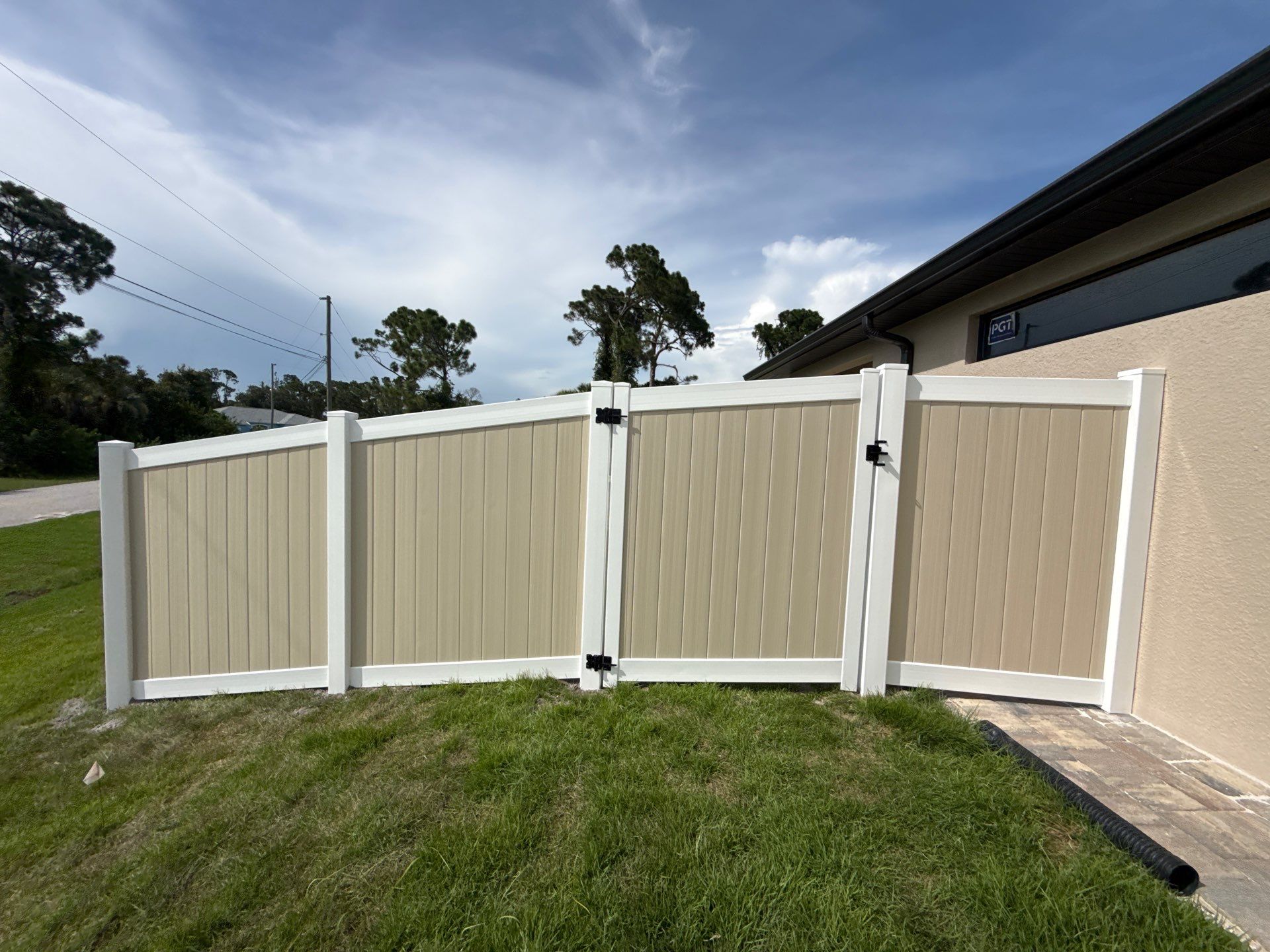 Custom Two-Tone Vinyl Privacy Fence Installation in North Port by True Fence LLC
