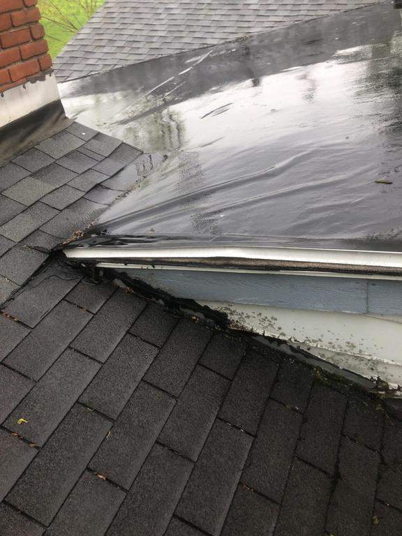 Residential Roofing Installation using 60 mil rubber roof  by Nitro Roofing and Construction