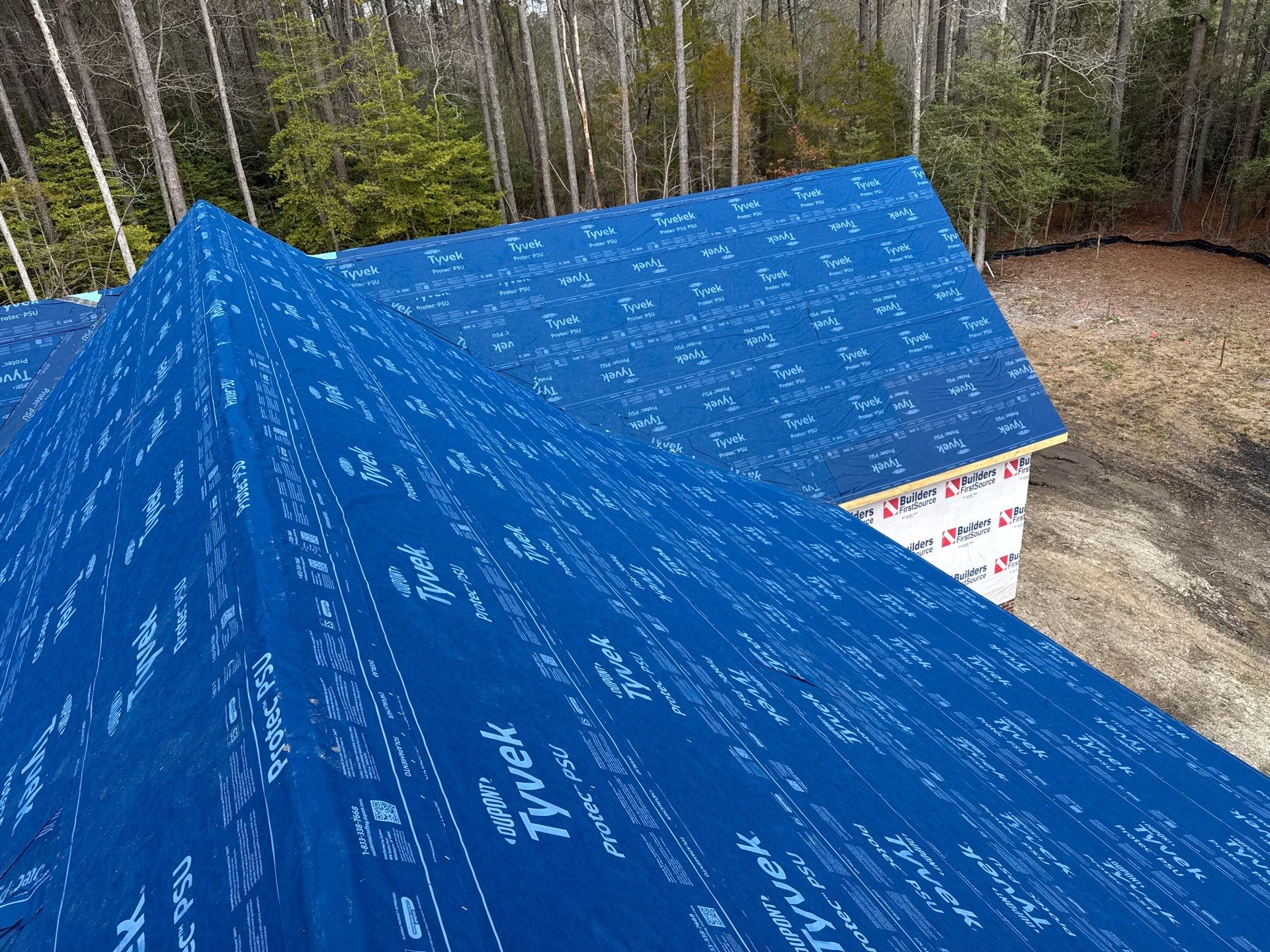 Custom New Construction Home Featuring Standing Seam Metal Roofing in Port Haywood by Cade Construction