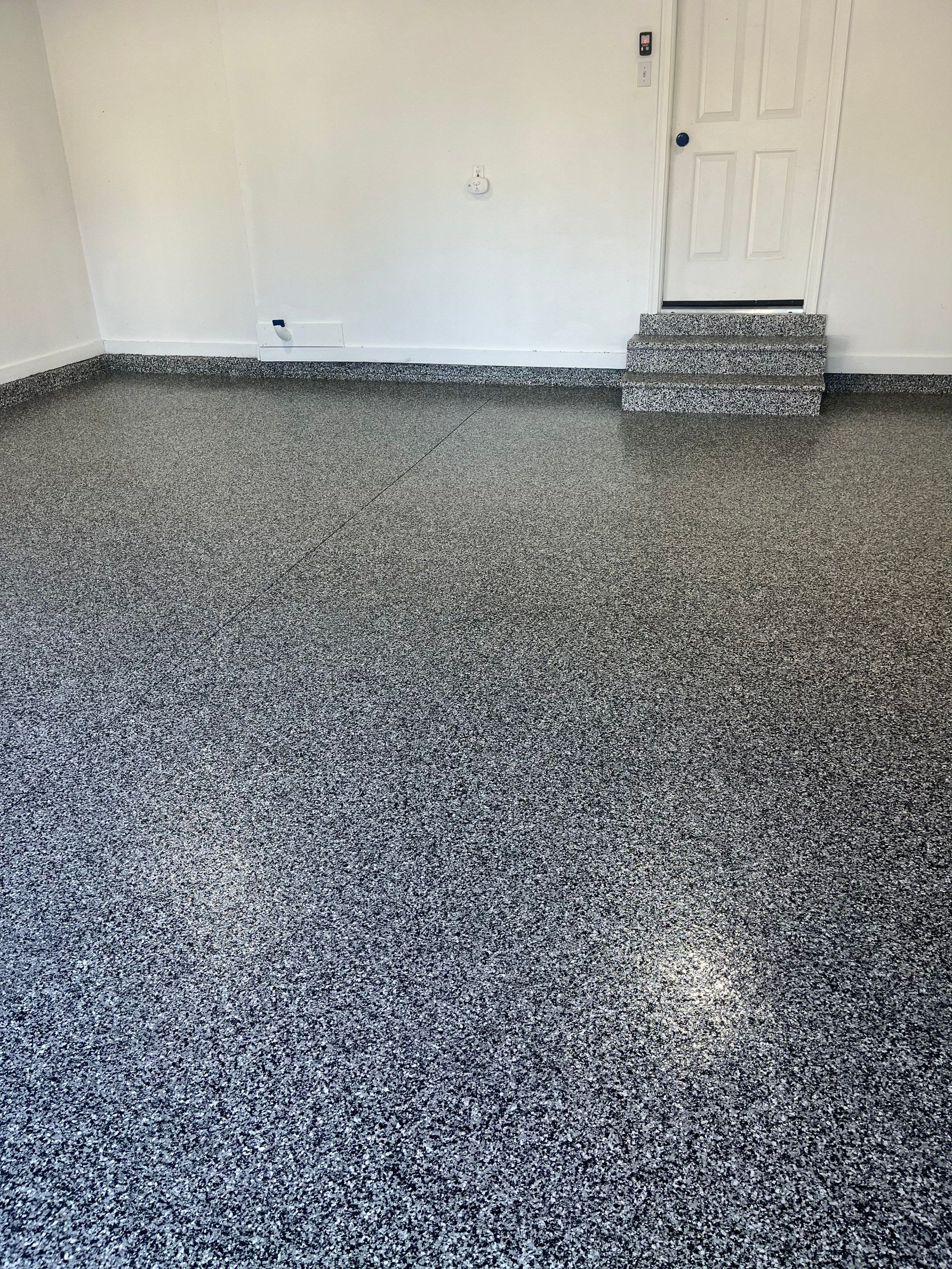 Johnston Garage Coating in Domino by Revival Concrete Coatings, LLC