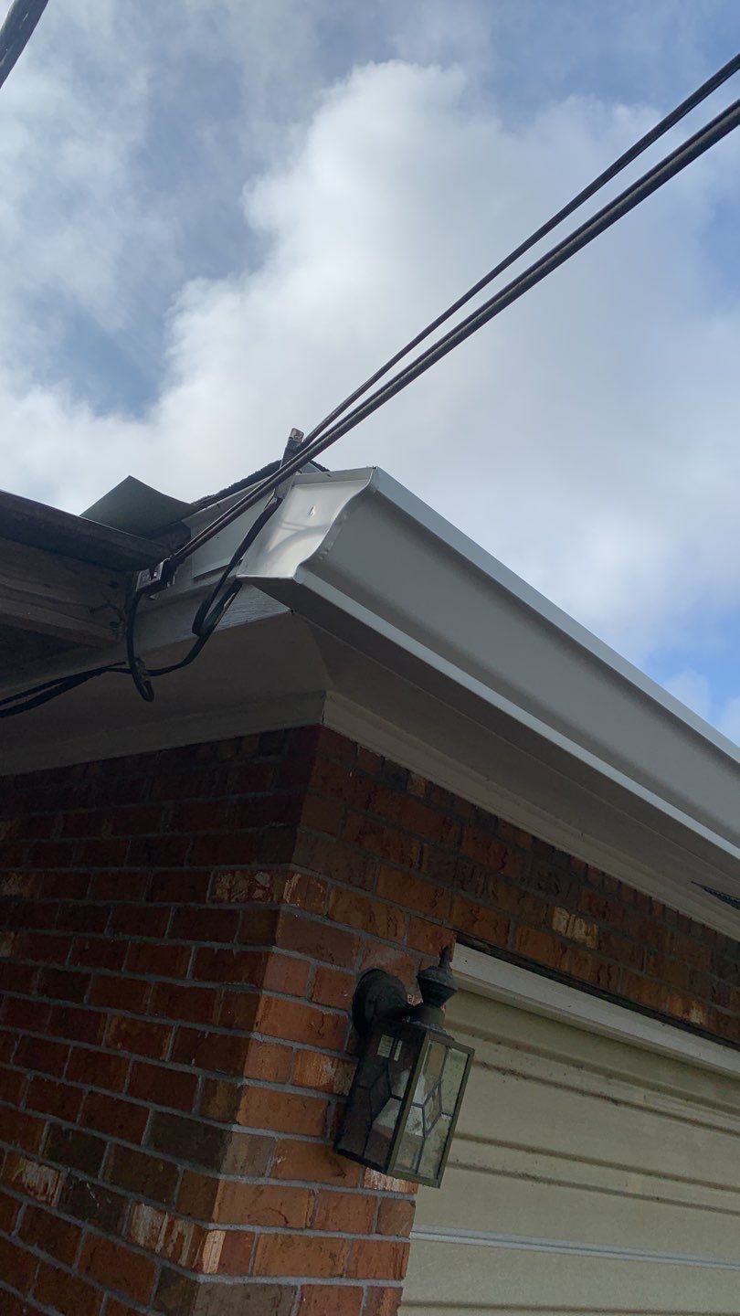 Seamless Aluminum Gutter and Down Spout Installation by Gutter Professors