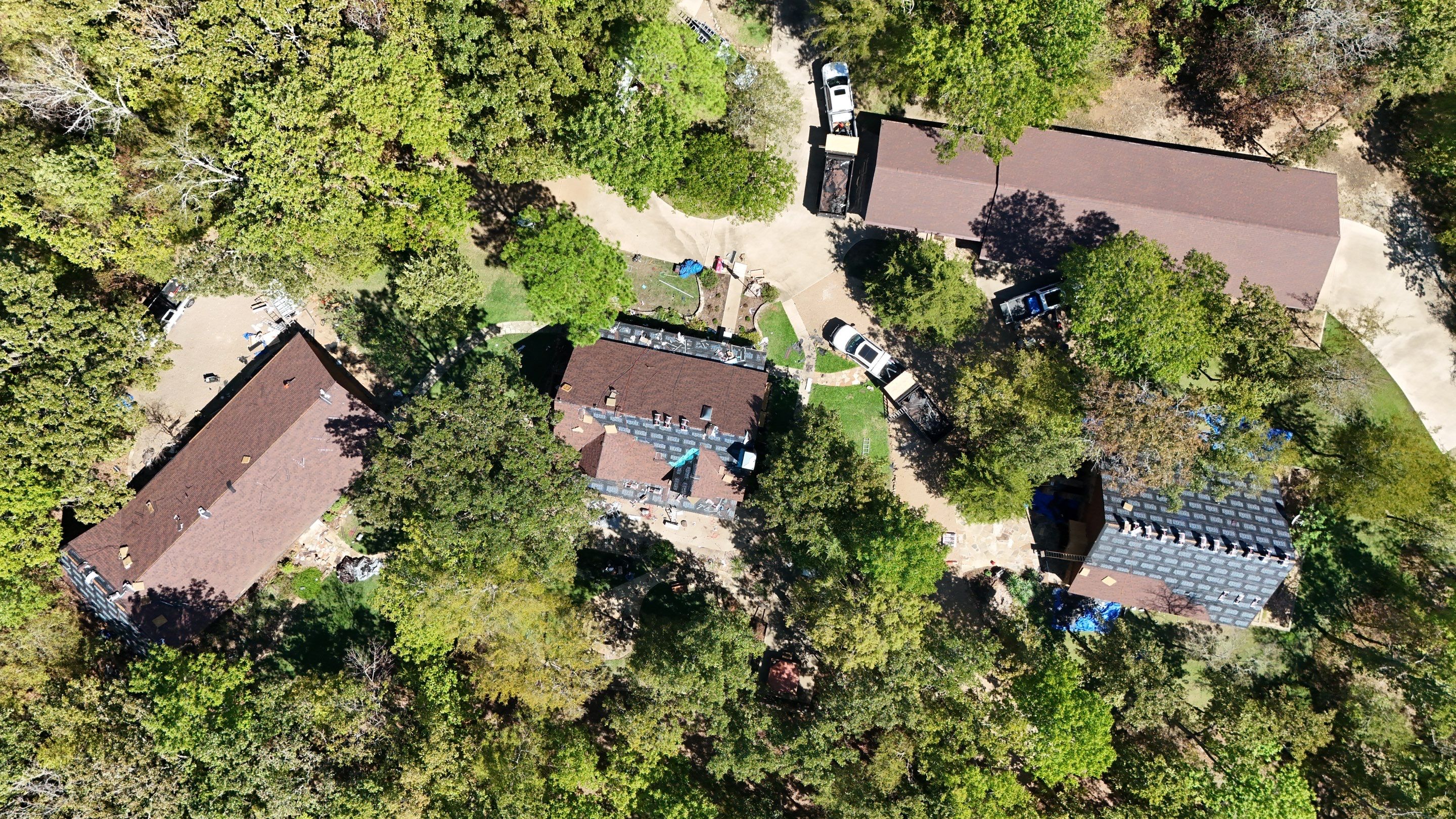 Multi-Building Log Cabin Roof Replacement with Architectural Shingles in Quitman by Armor Roofing | Exteriors