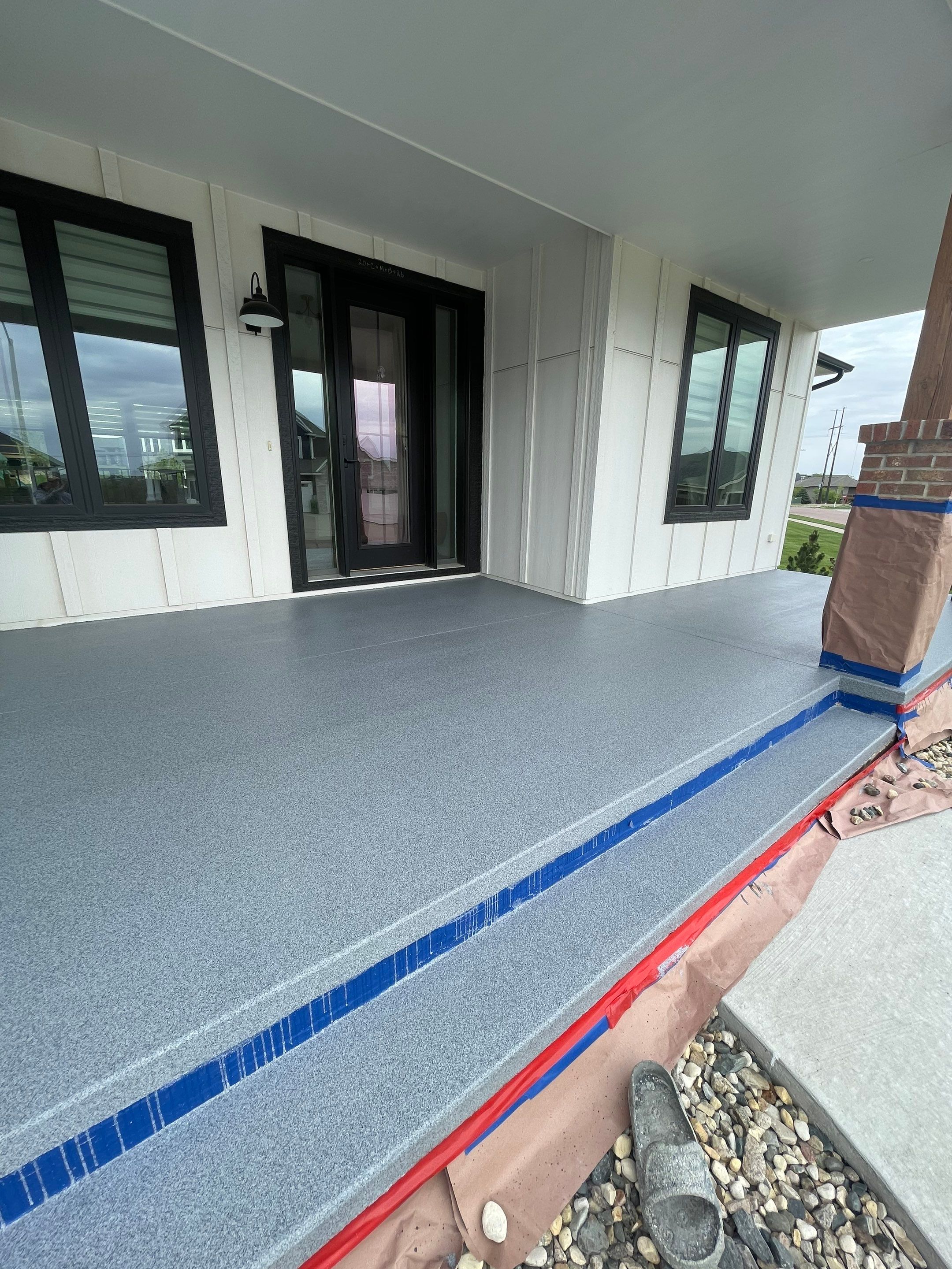 Grey Speckled Concrete Porch Coating for Sioux Falls Home by Select Painting, Coatings & Garage Cabinets