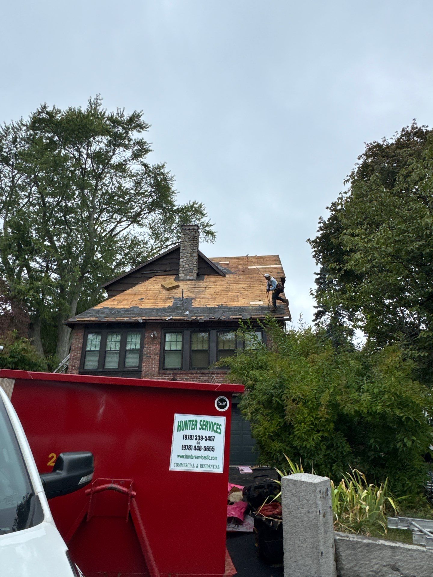 Roof Replacement with Skylight & Downspout Work in Belmont, MA by Mighty Dog Roofing of Greater Middlesex County
