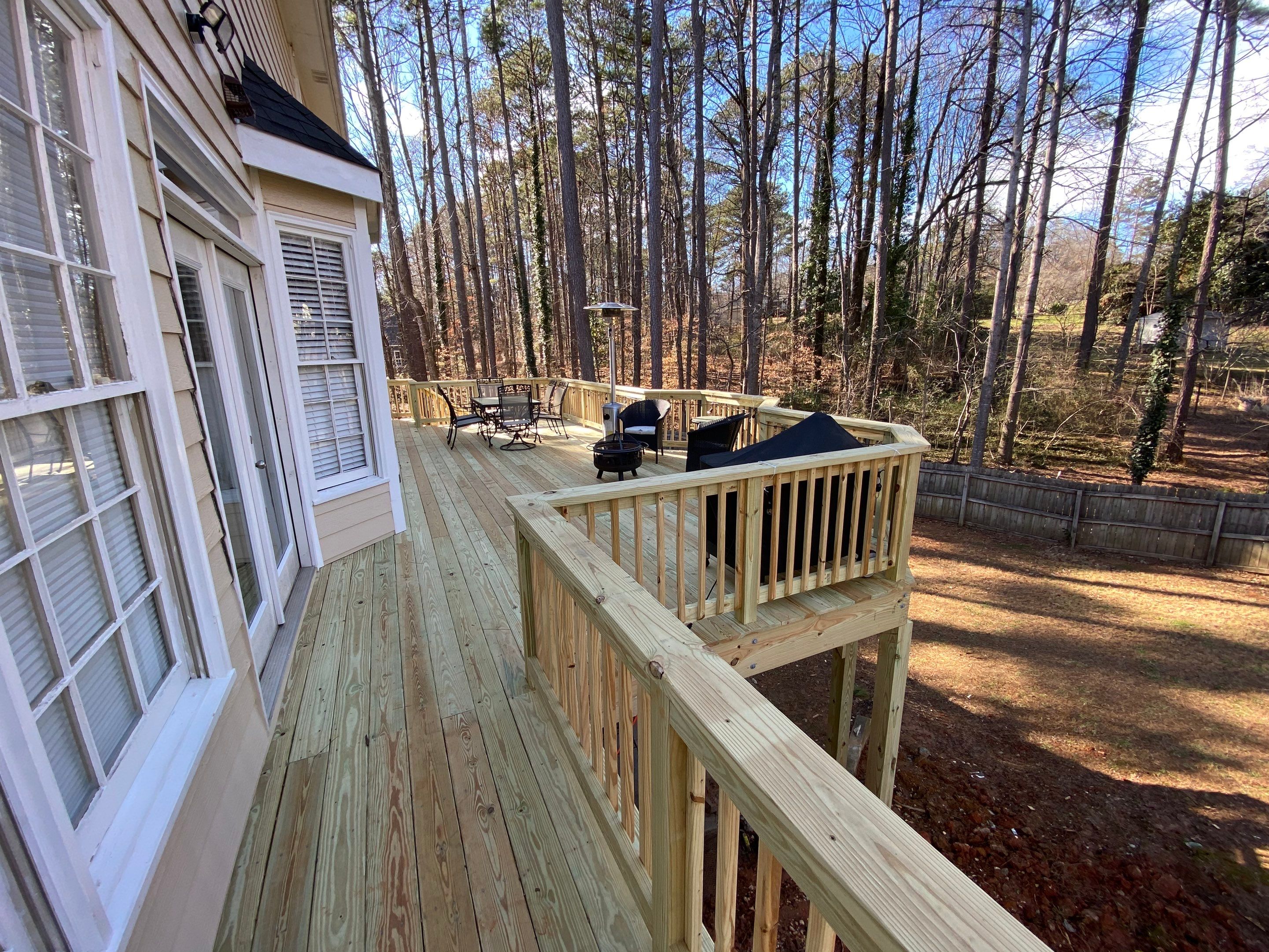 Elevated Pressure-Treated Wood Deck Replacement and Staircase in Duluth by Swift Home Renovations