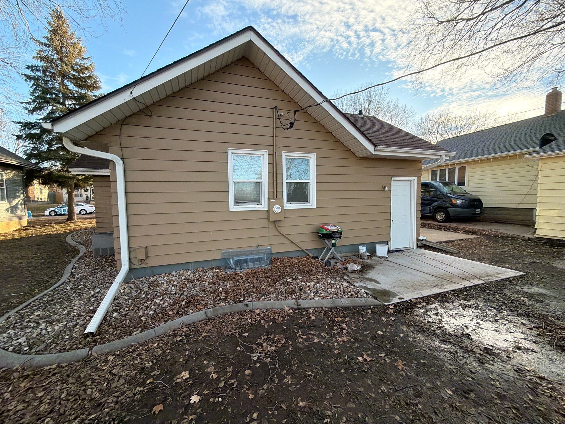 Exterior Siding Repair and Full House Repaint in Sioux Falls by Select Painting, Coatings & Garage Cabinets