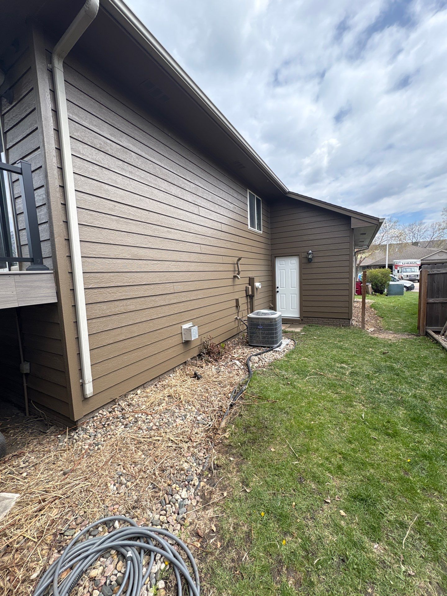 Exterior Painting and Wood Trim Replacement in Sioux Falls by Select Painting, Coatings & Garage Cabinets