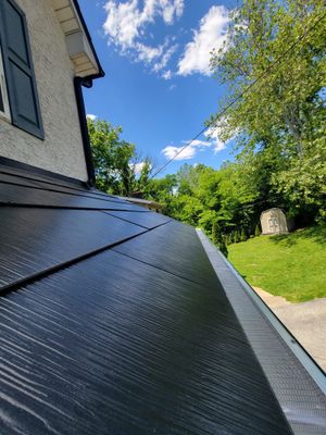 Tesla Solar Roof, Powerwall, and Black Gutters
