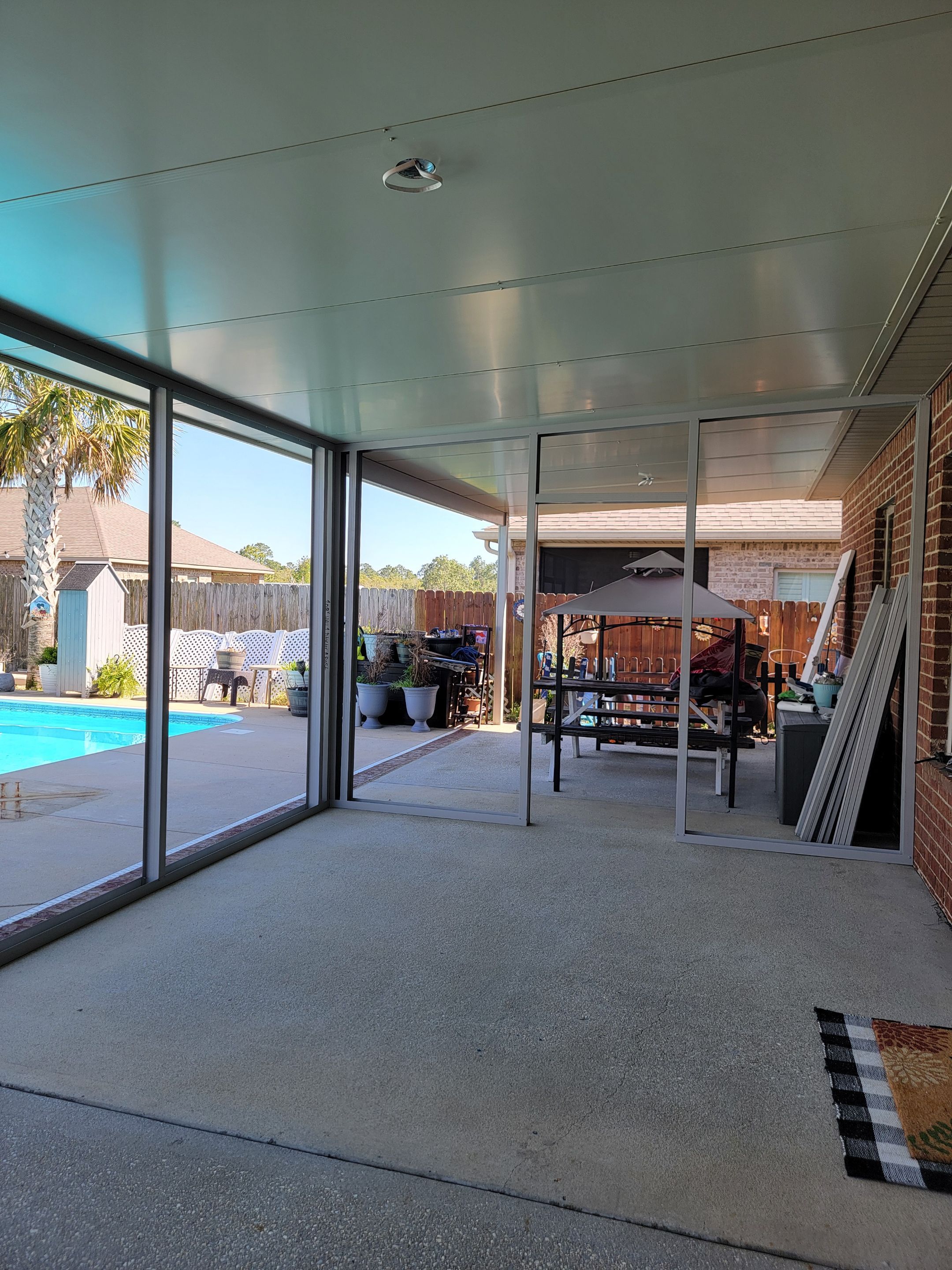 Poolside Screen Room & Patio Cover in Gulf Breeze by Titan Sunrooms