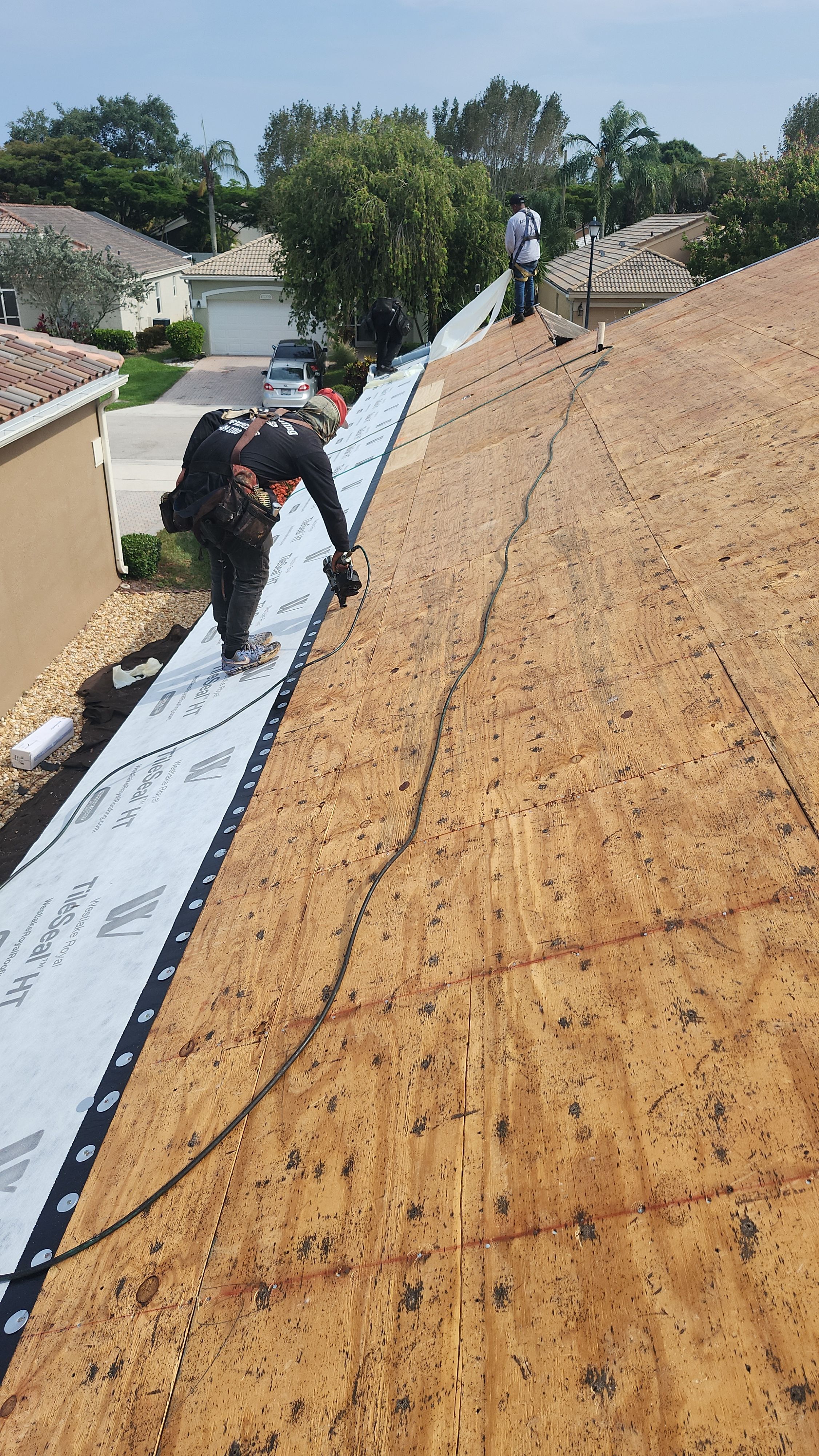 New Barrel Tile Roof Installation and Decking Repair in Boynton Beach by Aastro Roofing