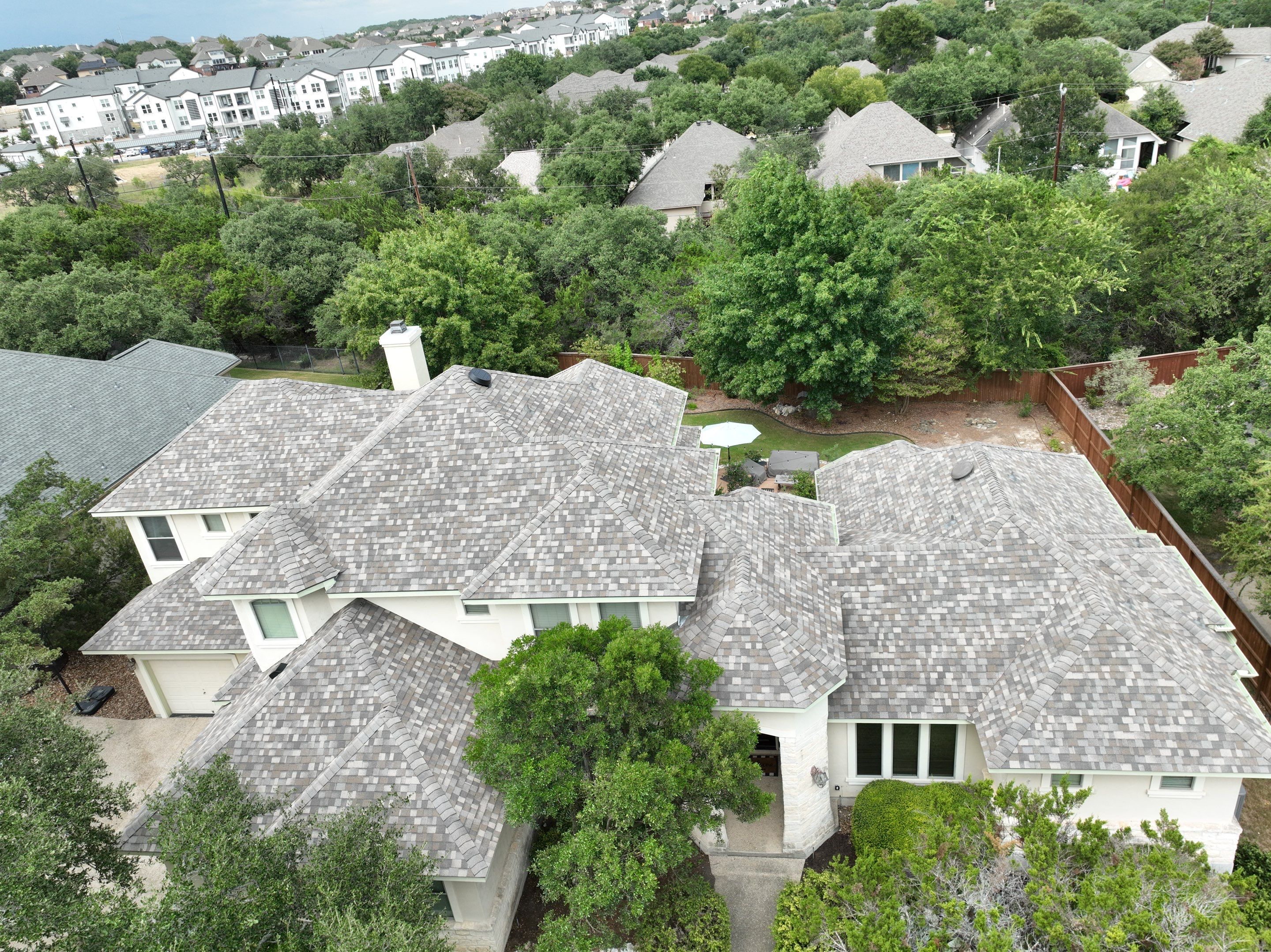 Residential Roof Replacement using 30 Year Laminate Shingles with High Profile Ridge by Premier Roofing and Contracting
