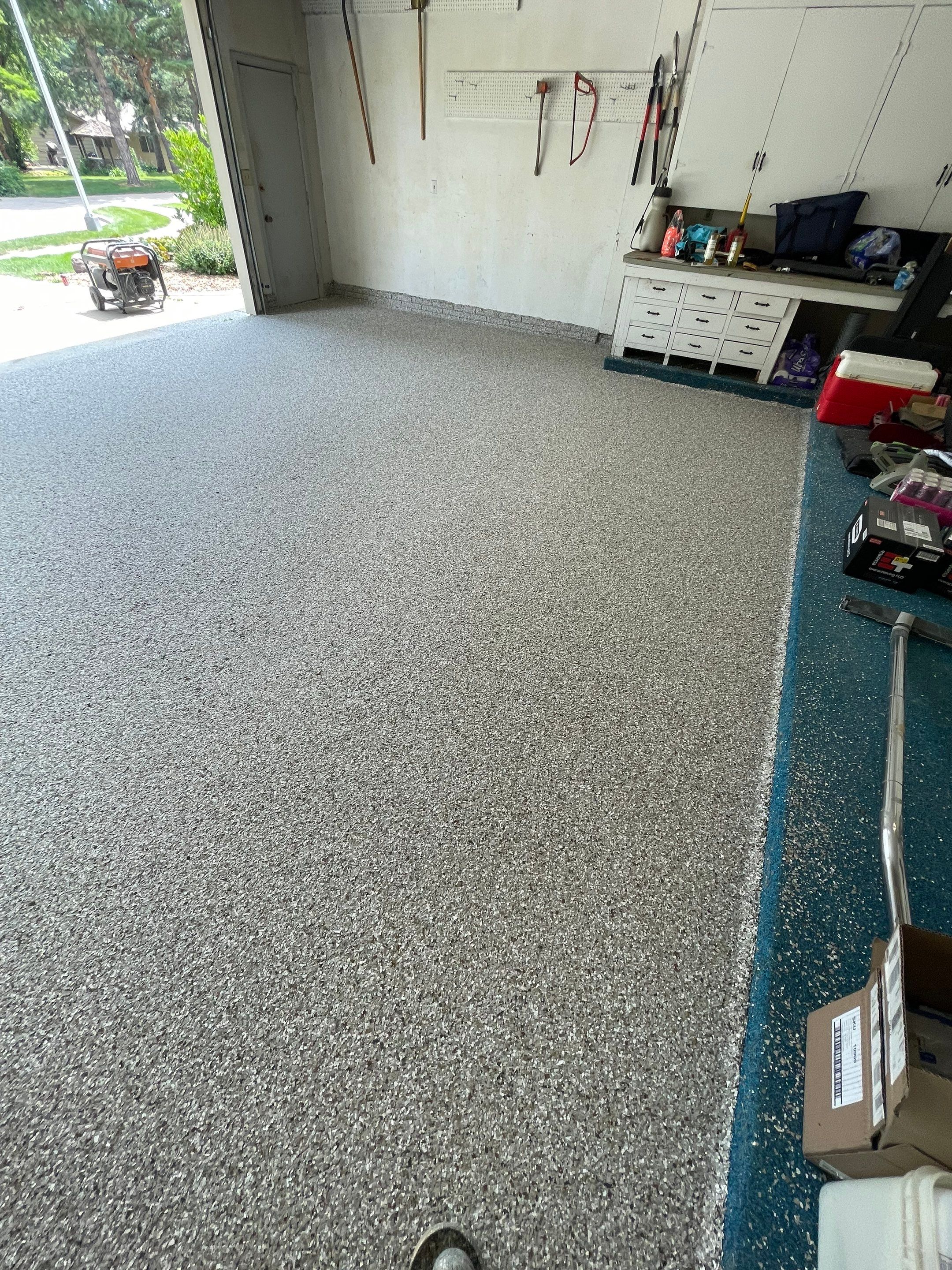 Custom Creekbed Garage Floor Coating in Sioux Falls by Select Painting, Coatings & Garage Cabinets