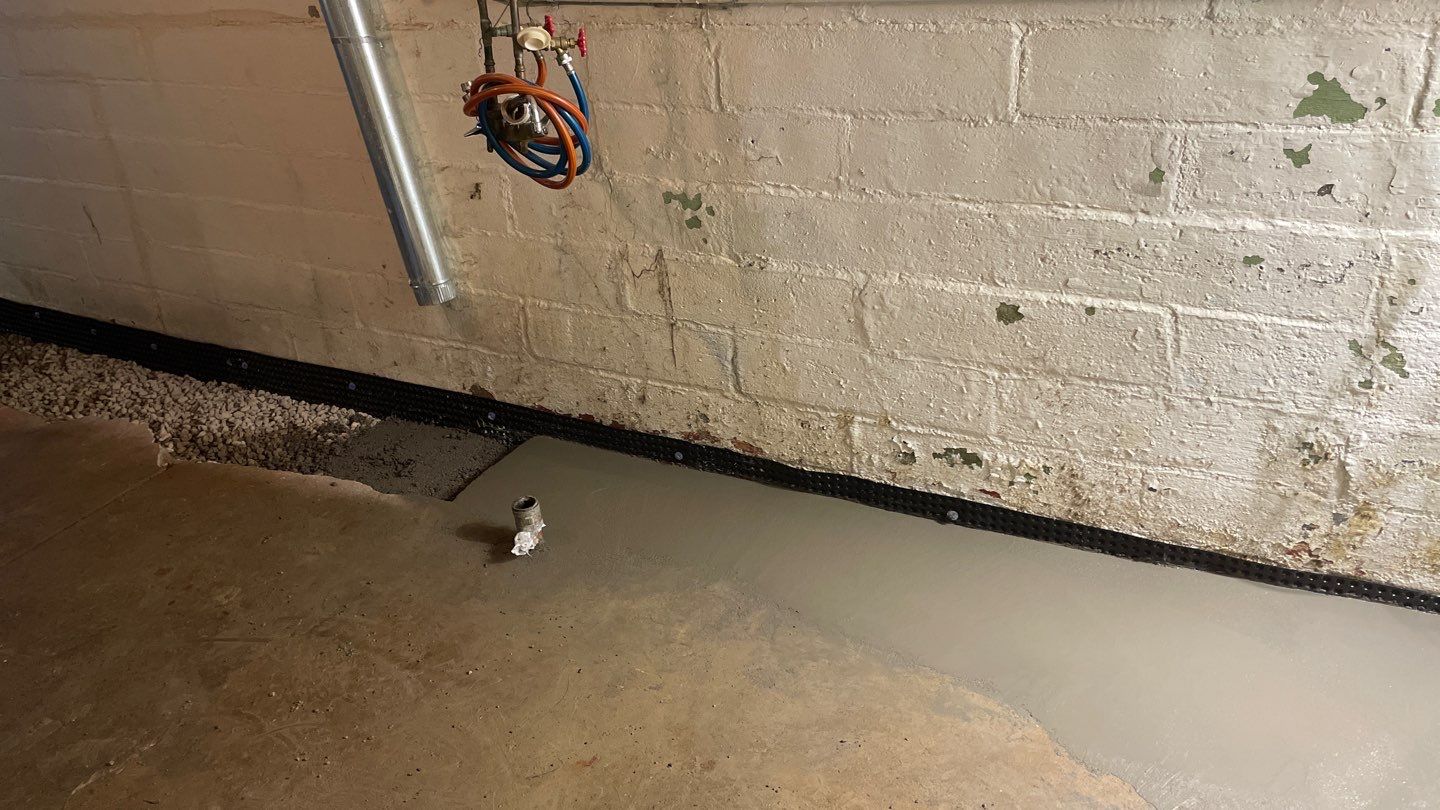 Interior Drain Tile & Sump Pump System in North Minneapolis by Waterproofing Northeast