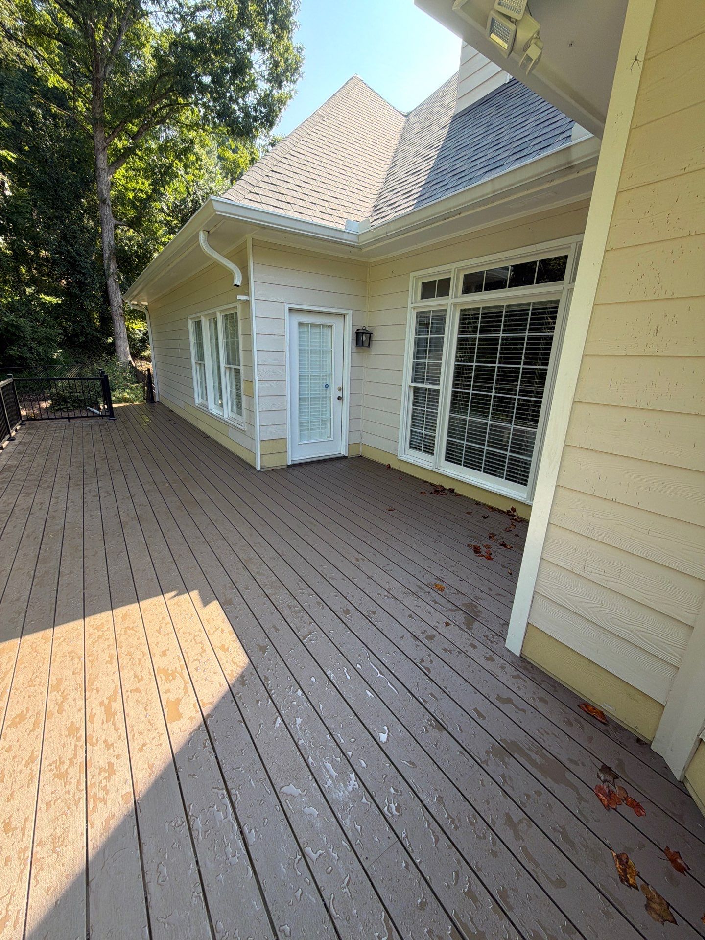 Elevated Composite Deck Replacement with Metal Railings in Smyrna by Swift Home Renovations 