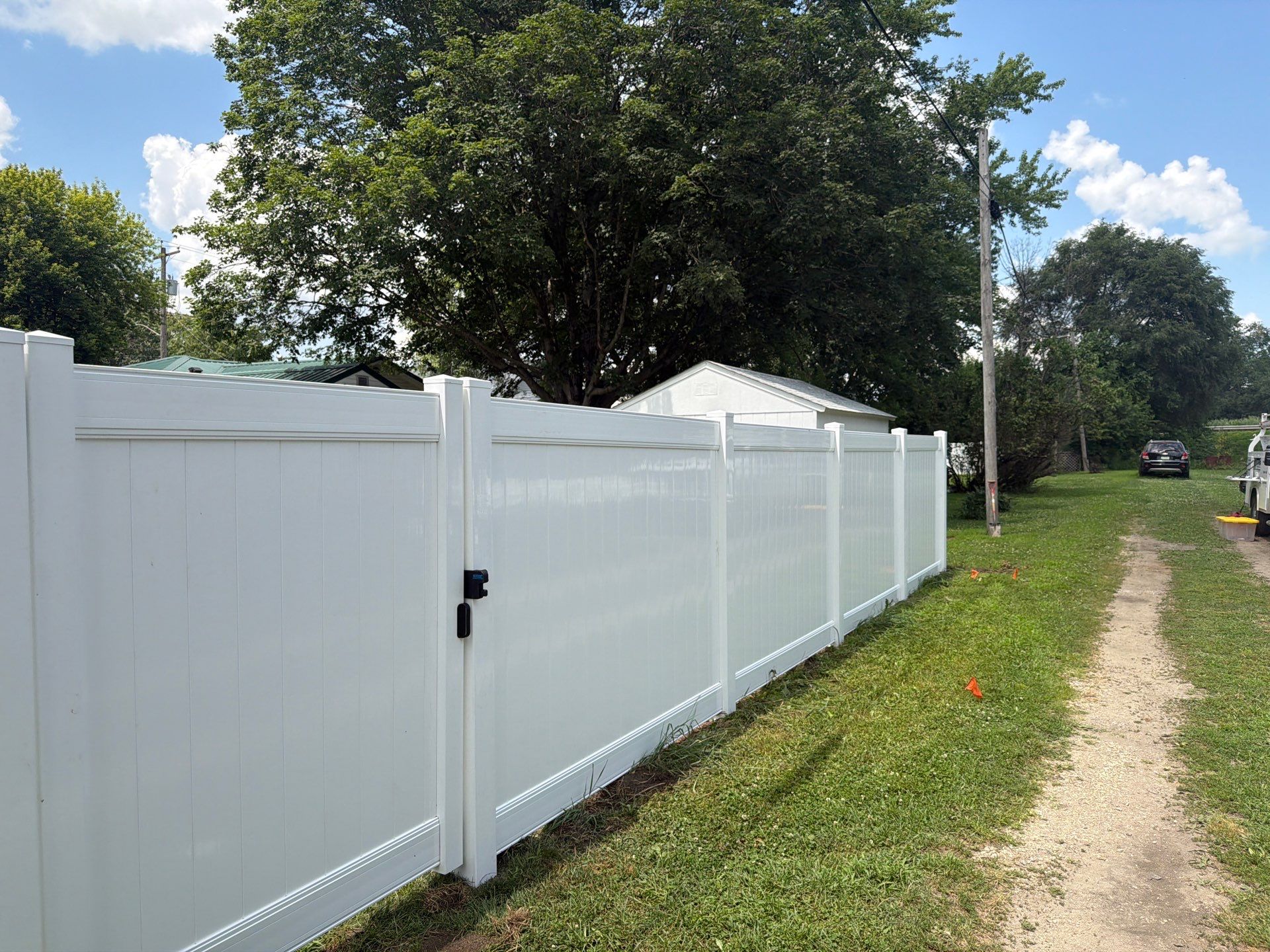 White Vinyl Privacy Fence Installation in Waterloo, Iowa by Perfect Picket Fence and Stain
