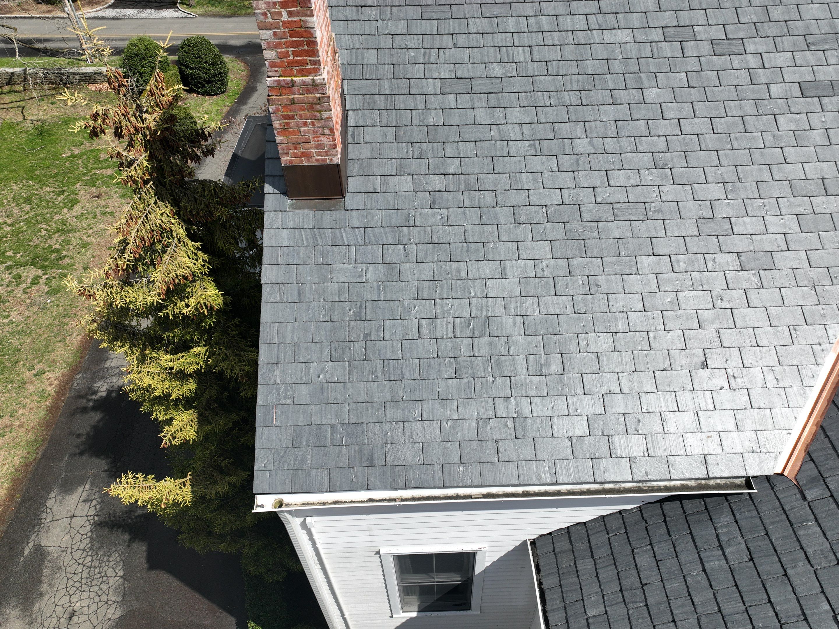 Residential Roofing Installation using Vermont Slate by A Plus Exterior
