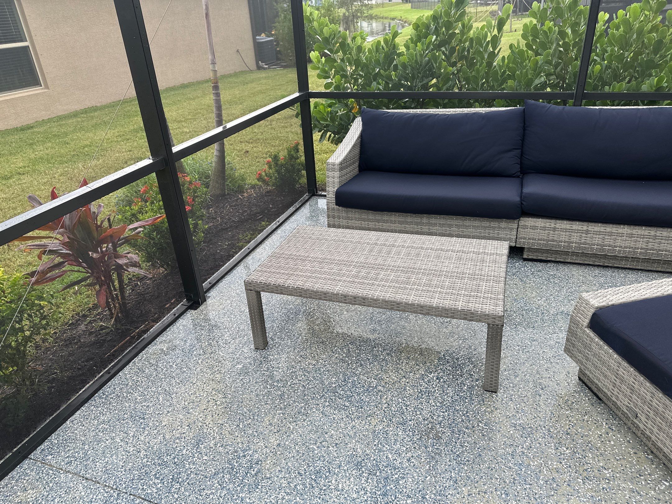 Lanai & Patio Cleaning with Epoxy-Coated Concrete Floor in Trevesta Community, Palmetto, FL | Sunshine AquaWash by Sunshine AquaWash
