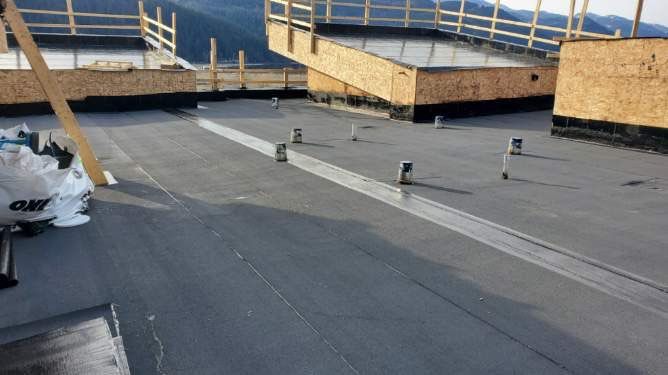 Commercial Roofing Installation using IKO 2ply sbs  by Top Notch Roofing Inc
