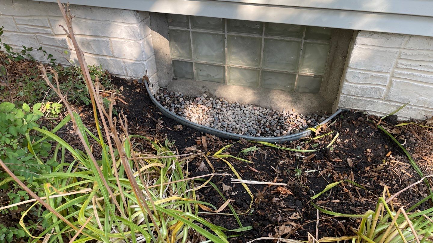 Drain Tile, Window Wells & Buried Discharge in Minneapolis by Waterproofing Northeast